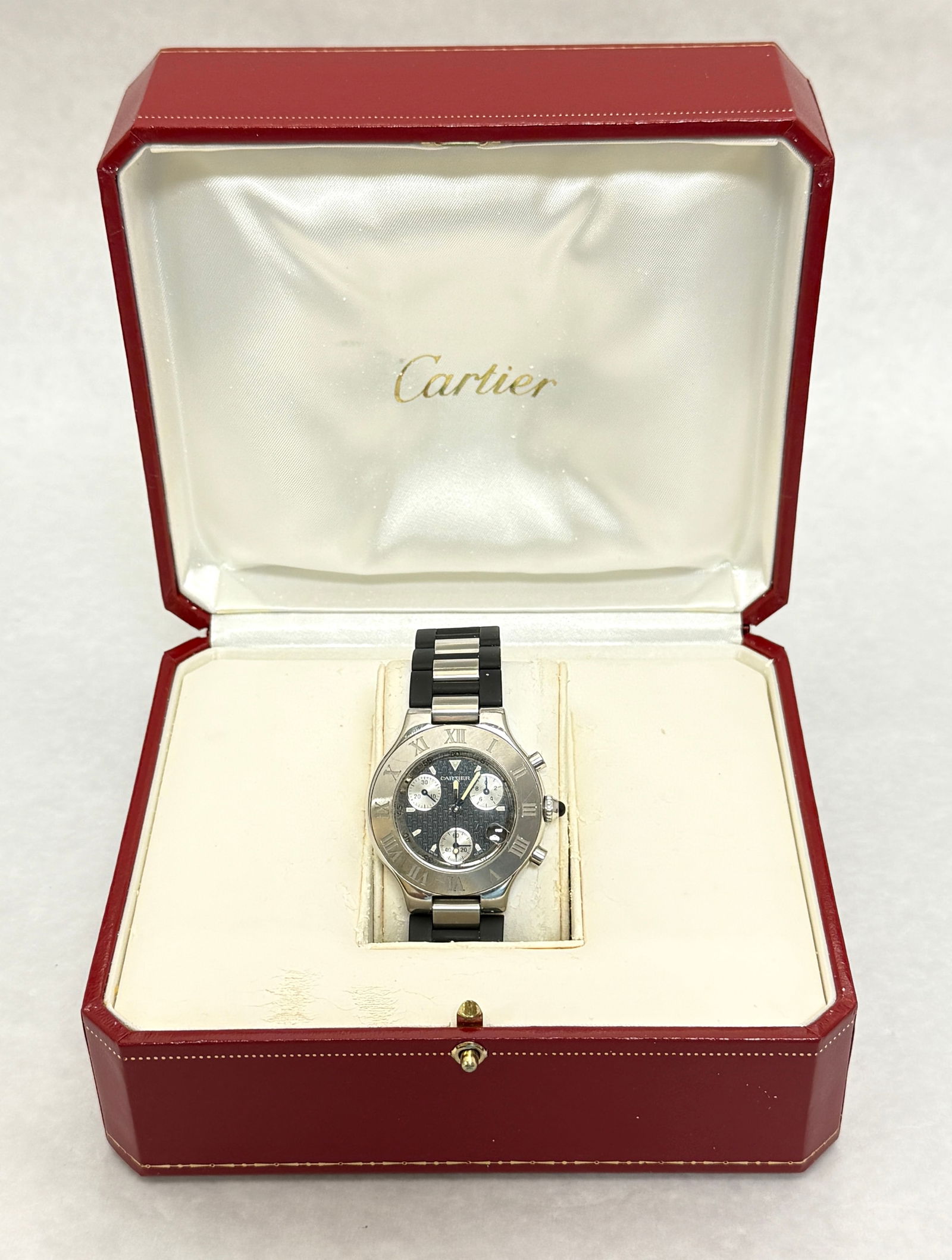 Cartier Man's Watch: Cartier man's Chronoscaph silver and black watch in box with certificate. CONDITION: no chips, cracks, repairs or material defects found, Jaremos attempts to call any material flaw that affects the pr