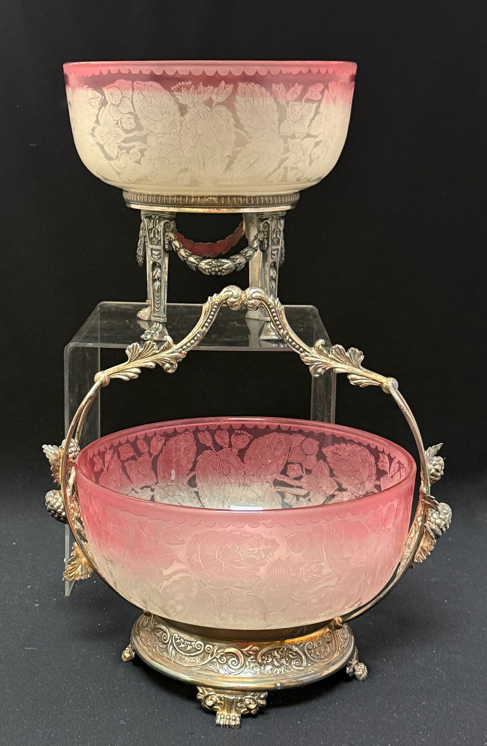 2 Rubina Etched Bride's Baskets: 2 Rubina etched bride's baskets one in a marked Pairpoint standing frame the other in a very nice ornate marked Pairpoint handled frame; tallest ht 8 1/4". CONDITION: no chips, cracks, repairs or mate