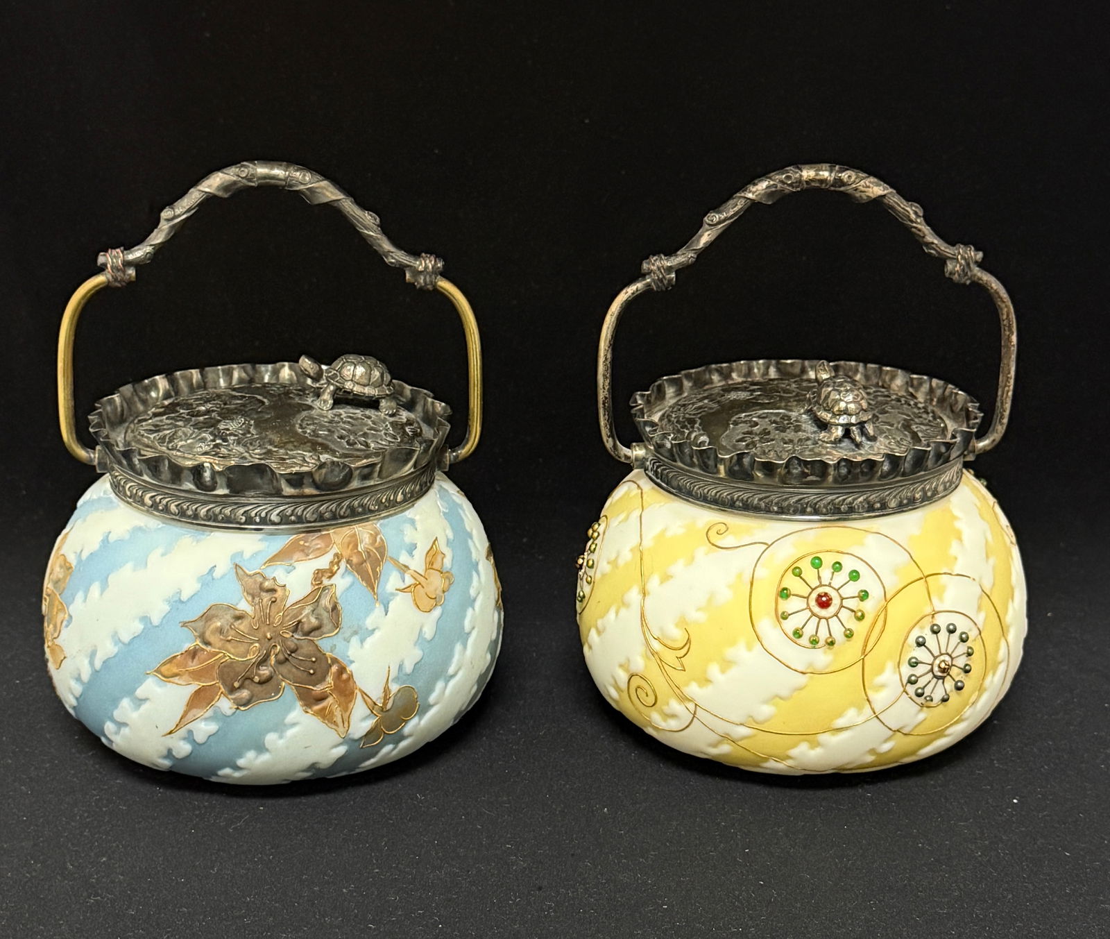 2 Crown Milano Sweet Meats: 2 Crown Milano sweet meat jars, one blue turtle track with gold enameled flowers the other yellow turtle track with gold stylized flowers and jewels, both have turtle lids marked MW; ht 5". LITERATURE