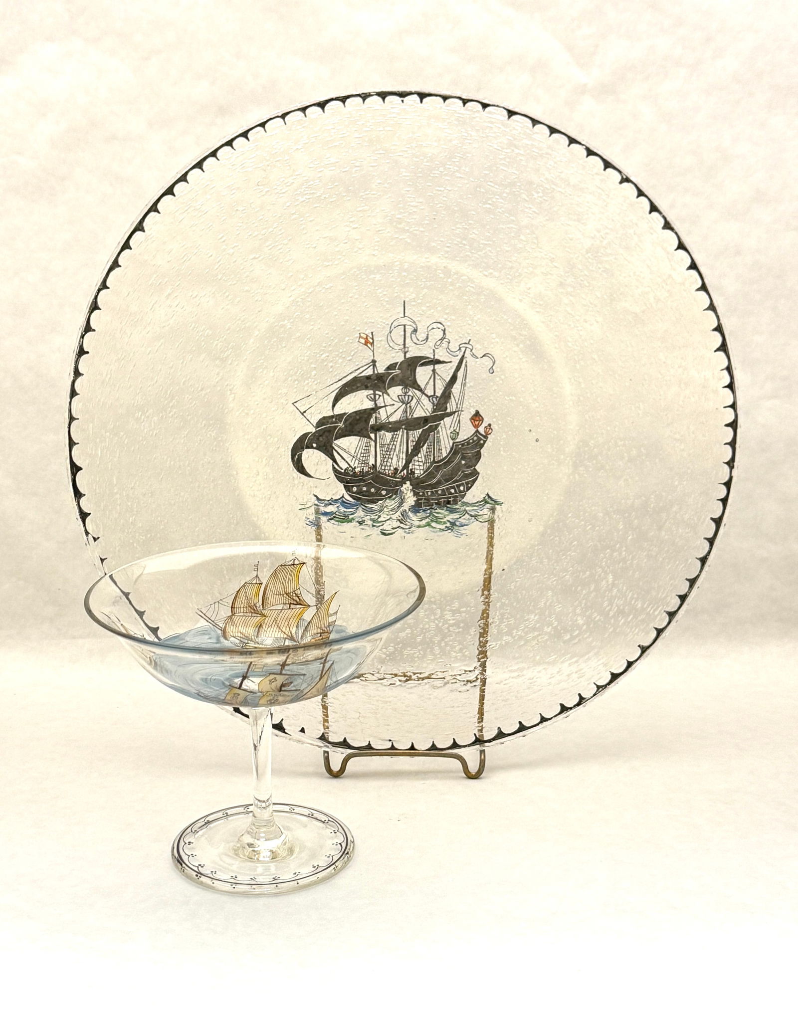 2 Pairpoint Tavern Ware Items: 2 Pairpoint Tavern Ware items including a small compote with sailing ships and a bubbled glass platter with sailing ship; platter diameter 12". CONDITION: no chips, cracks, repairs or material defects