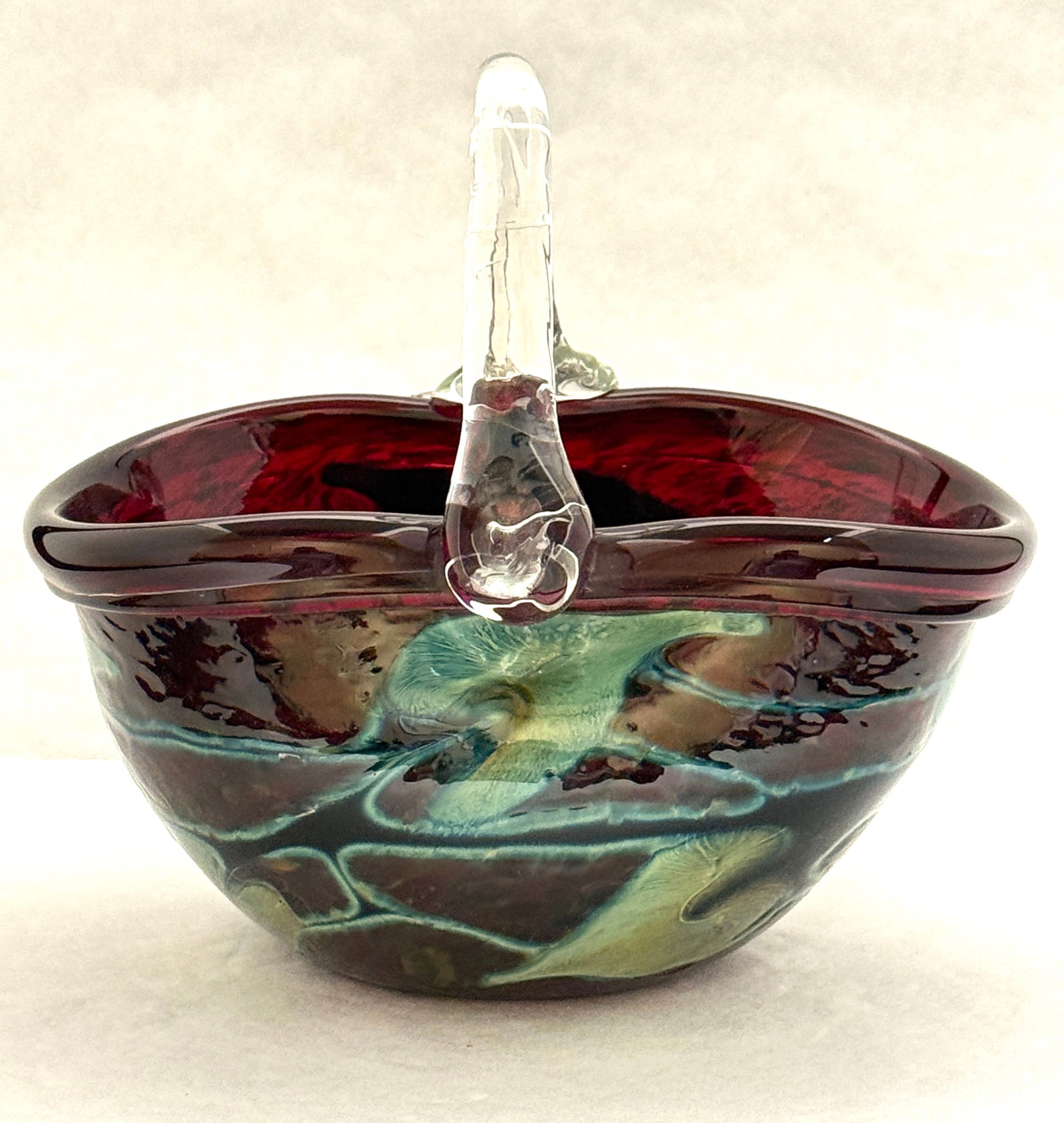 Charles Lotton Red Basket: Charles Lotton red with blue green heart and vine and a clear handle, signed Charles Lotton First Fruit; ht 6 1/2". CONDITION: no chips, cracks, repairs, or material defects found, Jaremos attempts to