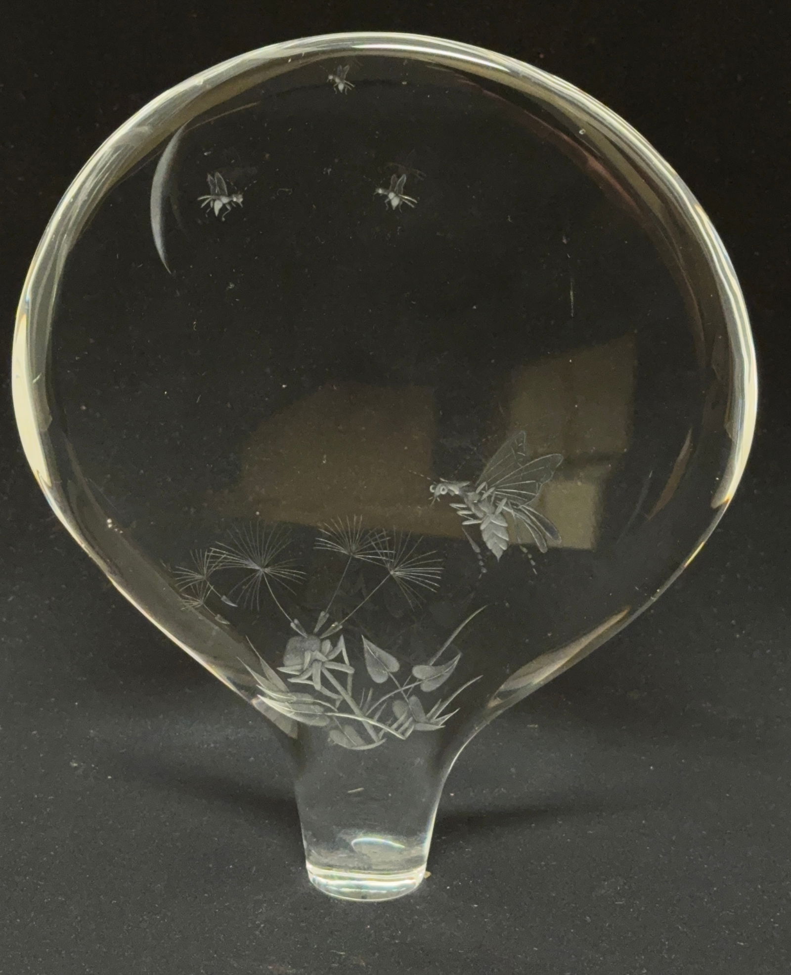 Steuben Etched Disk: Steuben clear disk etched with flower and bees, signed Steuben; diameter 6 1/8". PROVENANCE: from the collection of Mark Chamovitz. CONDITION: no chips, cracks, repairs or material defects found, Jare