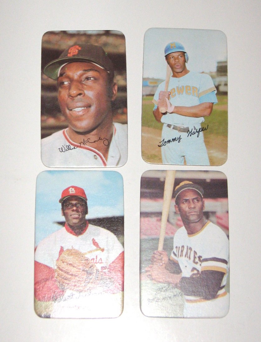 Four Topps 1971 large baseball cards,: including Roberto Clemente, Bob Gibson, Willie McCovey and Tommy Harper.