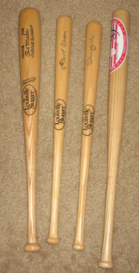 Four miniature wood bats,: including Paul Molitor, Hank Aaron, Robin Yount and 1999 Induction Cooperstown Hall of fame.