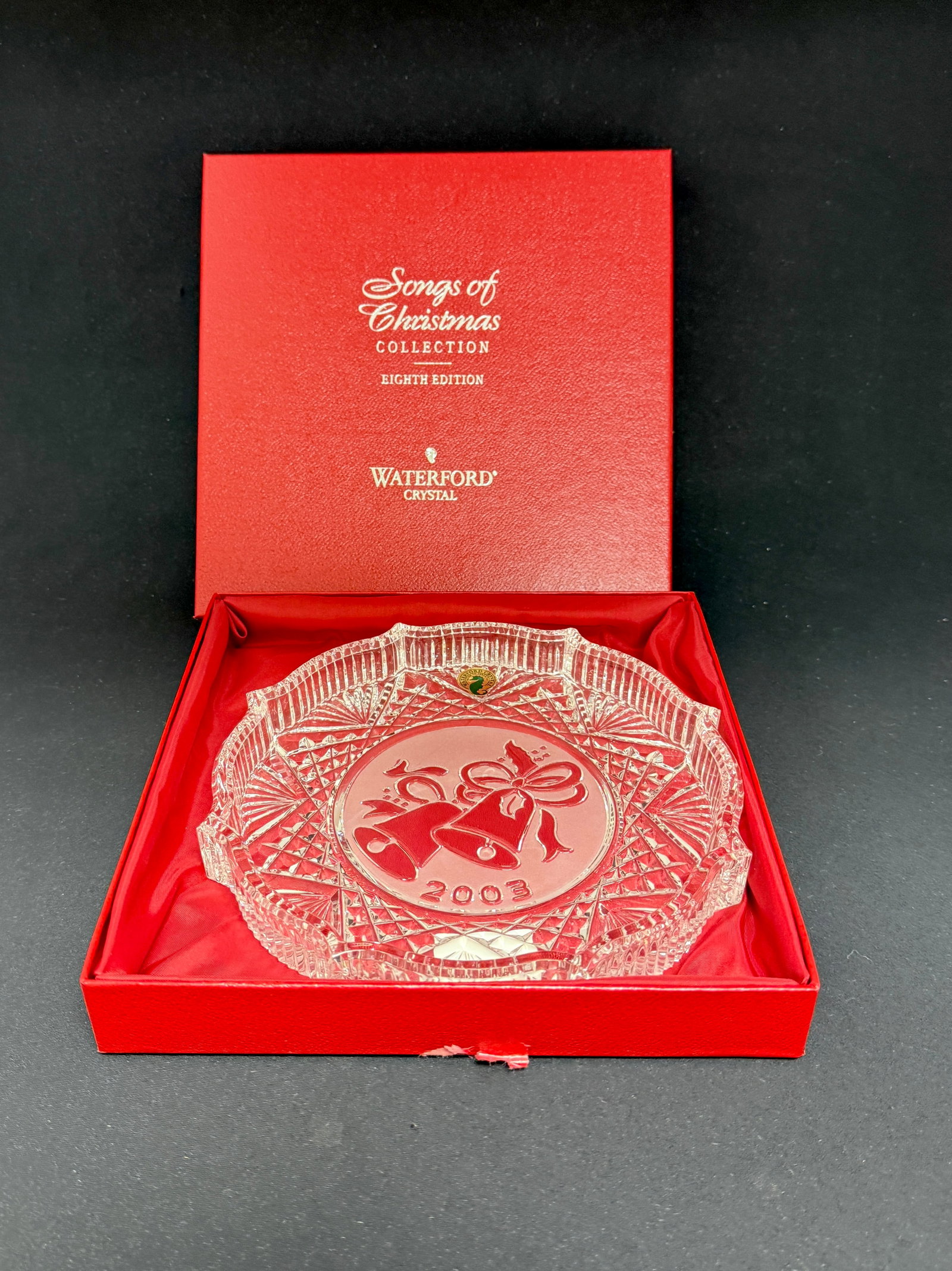 Waterford Songs of Christmas Plate: Waterford 2003 Songs of Christmas plate 8th edition in box; diameter 7 3/4". CONDITION: no chips, cracks, repairs, or material defects found, Jaremos attempts to call any material flaw that affects