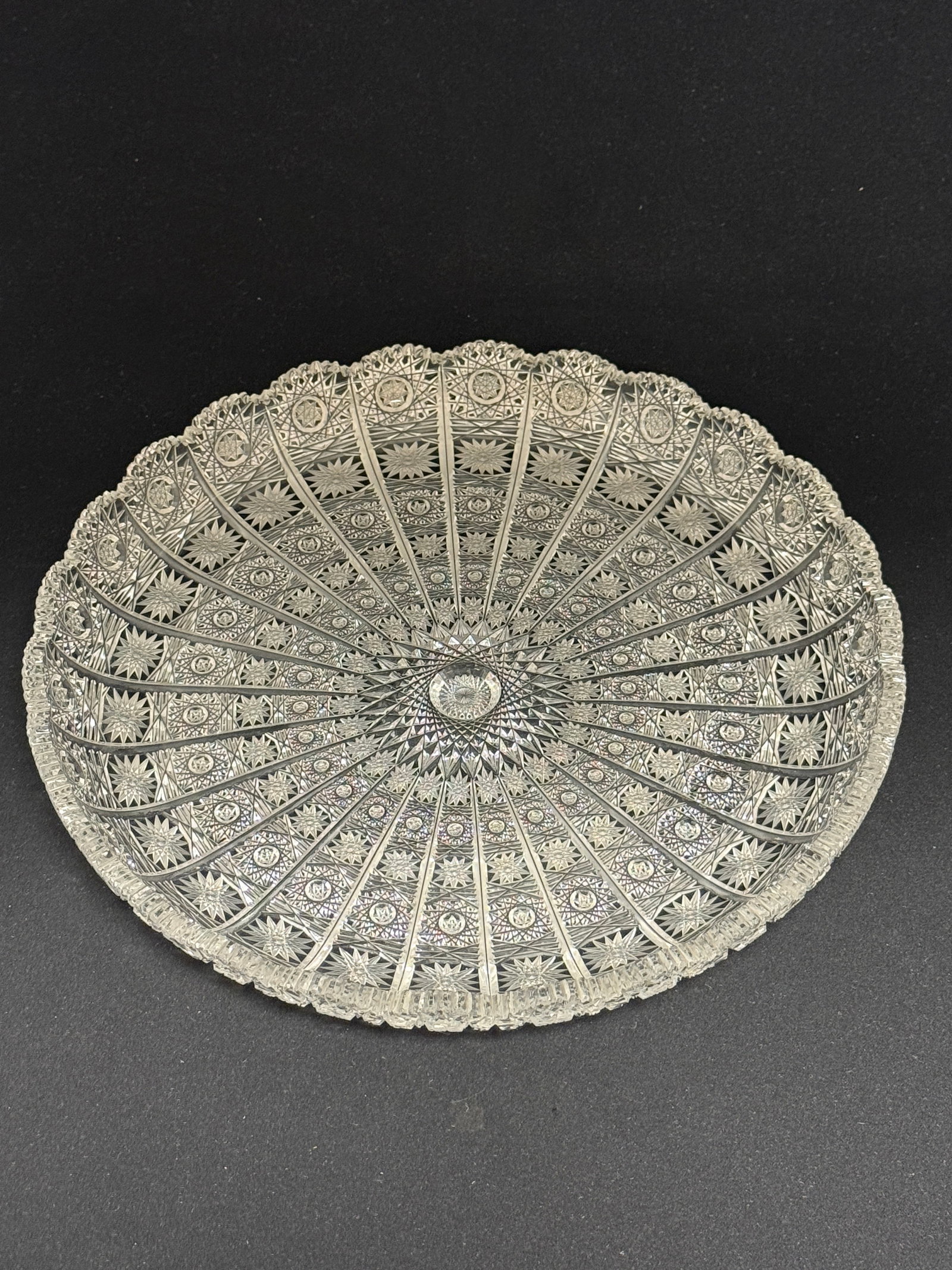 European Cut Glass Tray: European intricately cut glass round tray; diameter 11". CONDITION: no chips, cracks, repairs, or material defects found, Jaremos attempts to call any material flaw that affects the price, but minor