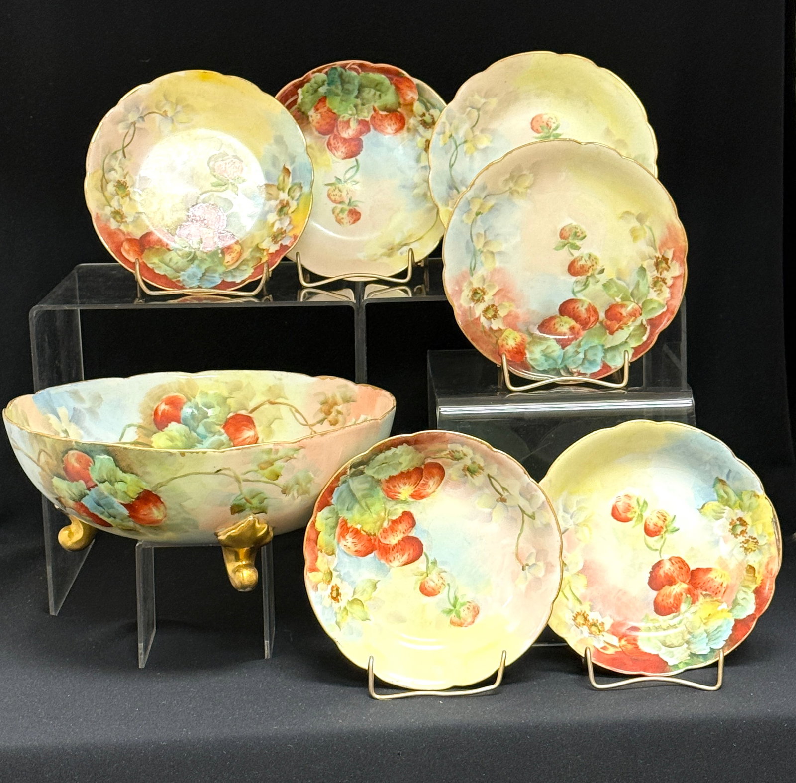 Limoges Berry Bowl Set: Limoges hand painted berry bowl set, footed serving bowl and 6 small bowls; diameter of largest 9 1/4". CONDITION: no chips, cracks, repairs, or material defects found, Jaremos attempts to call any ma