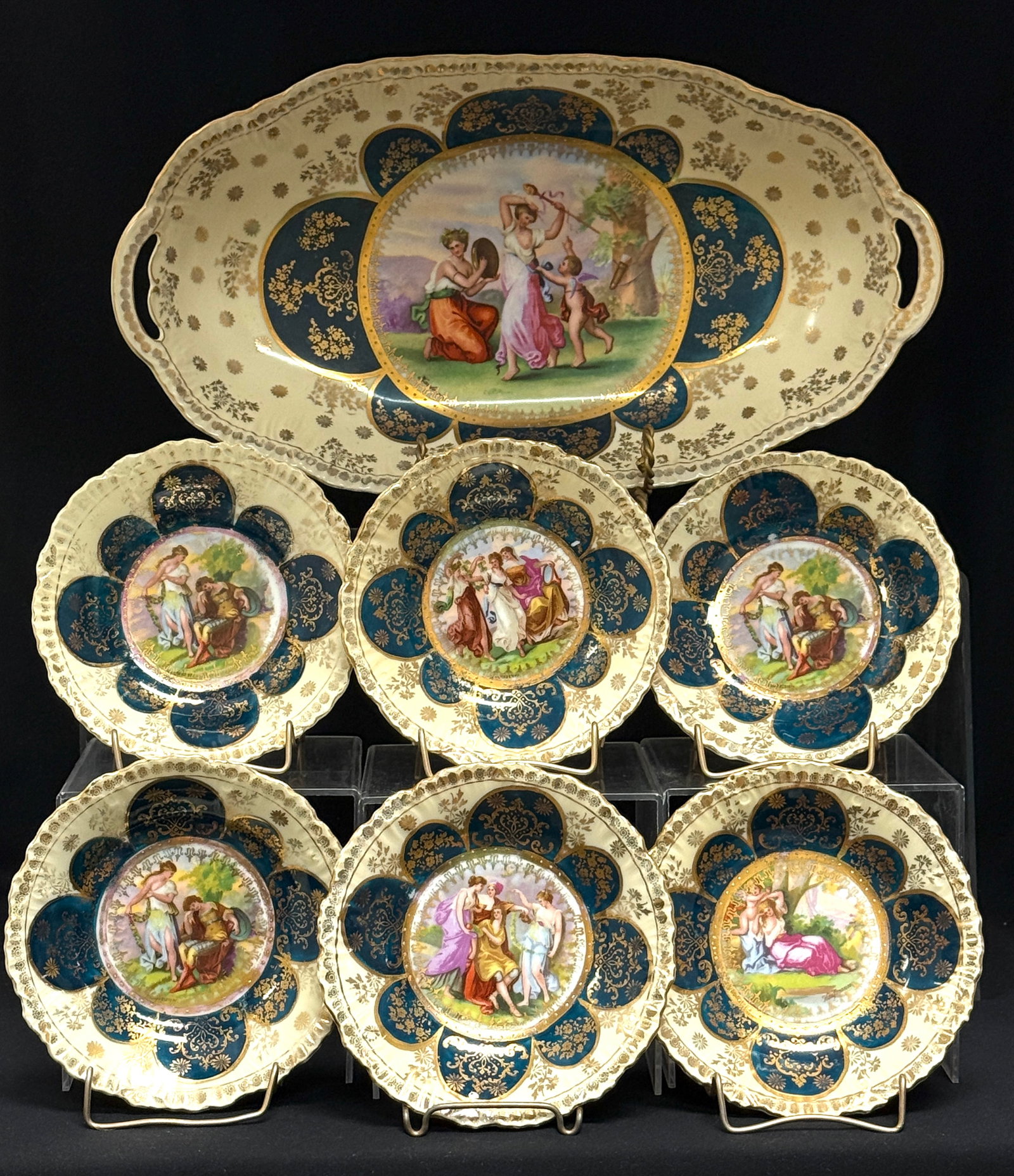 Austrian Porcelain Dessert Set: Austrian porcelain dessert set consisting of tray and 6 berry bowls, tray 15" length. CONDITION: no chips, cracks, repairs, or material defects found, Jaremos attempts to call any material flaw that