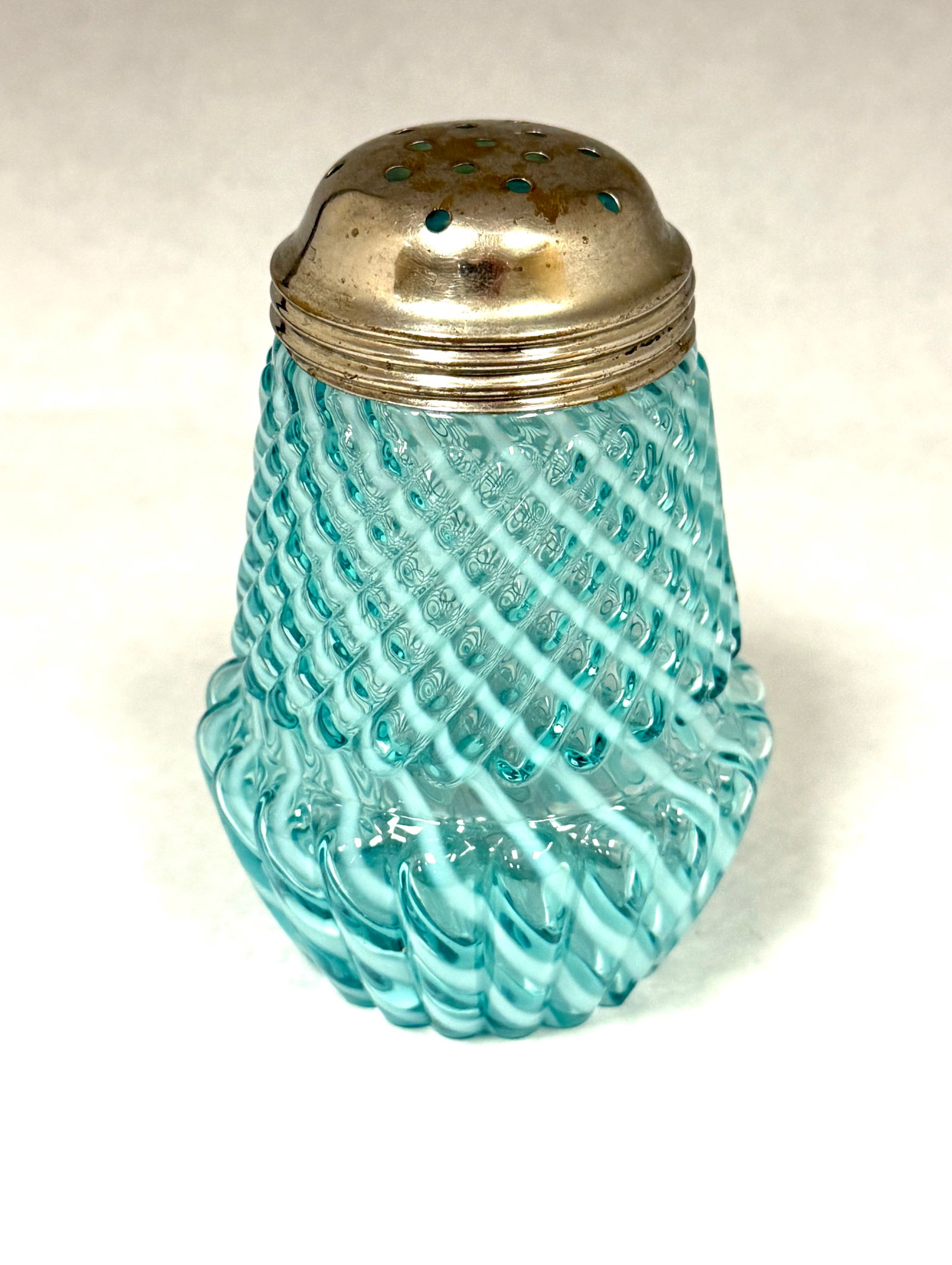 Chrysanthemum Base Shaker: Opalescent blue chrysanthemum base sugar shaker; ht. 4 1/2". CONDITION: no chips, cracks, repairs, or material defects found, Jaremos attempts to call any material flaw that affects the price, but