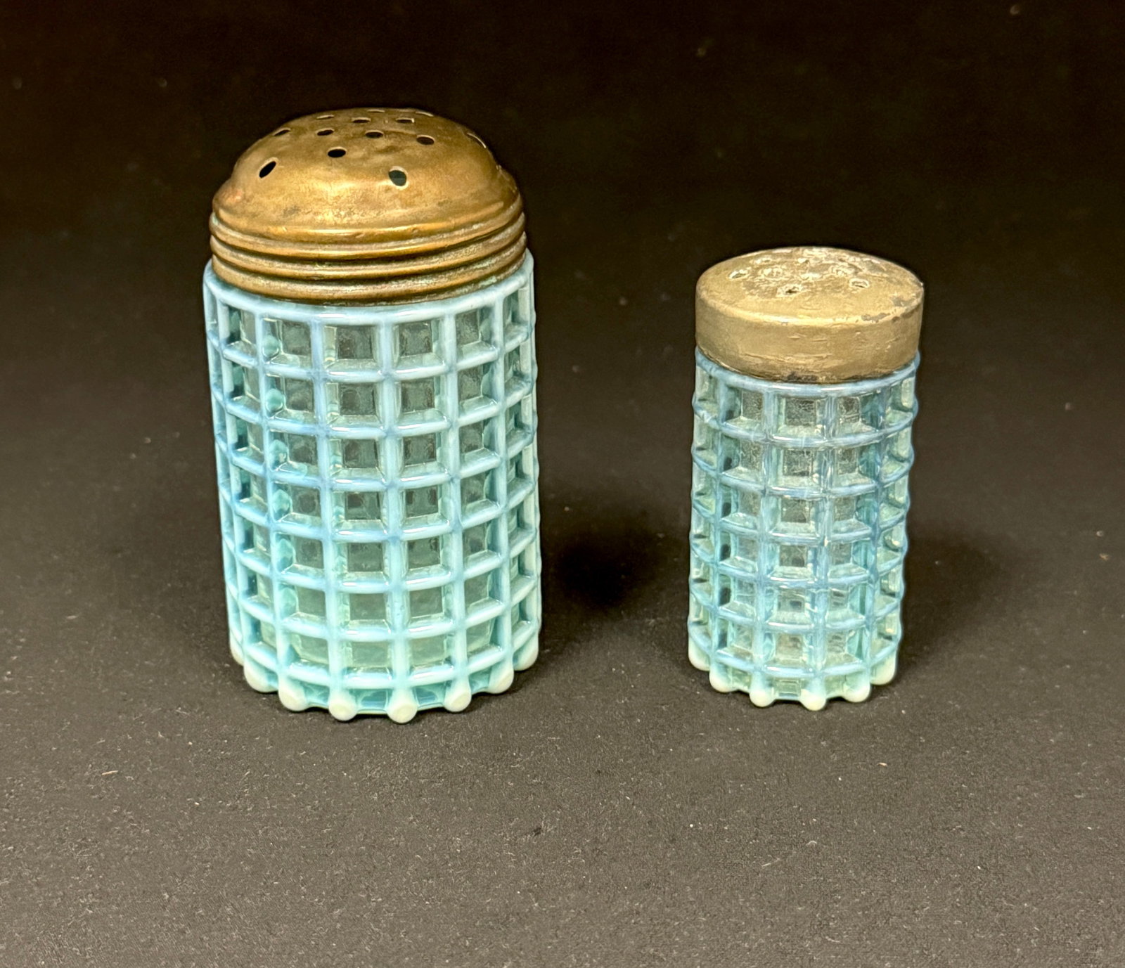 2 Beatty Comb Items: 2 blue Beatty comb items a short sugar shaker and one salt shaker; ht. tallest 3 3/4". CONDITION: no chips, cracks, repairs, or material defects found, Jaremos attempts to call any material flaw that