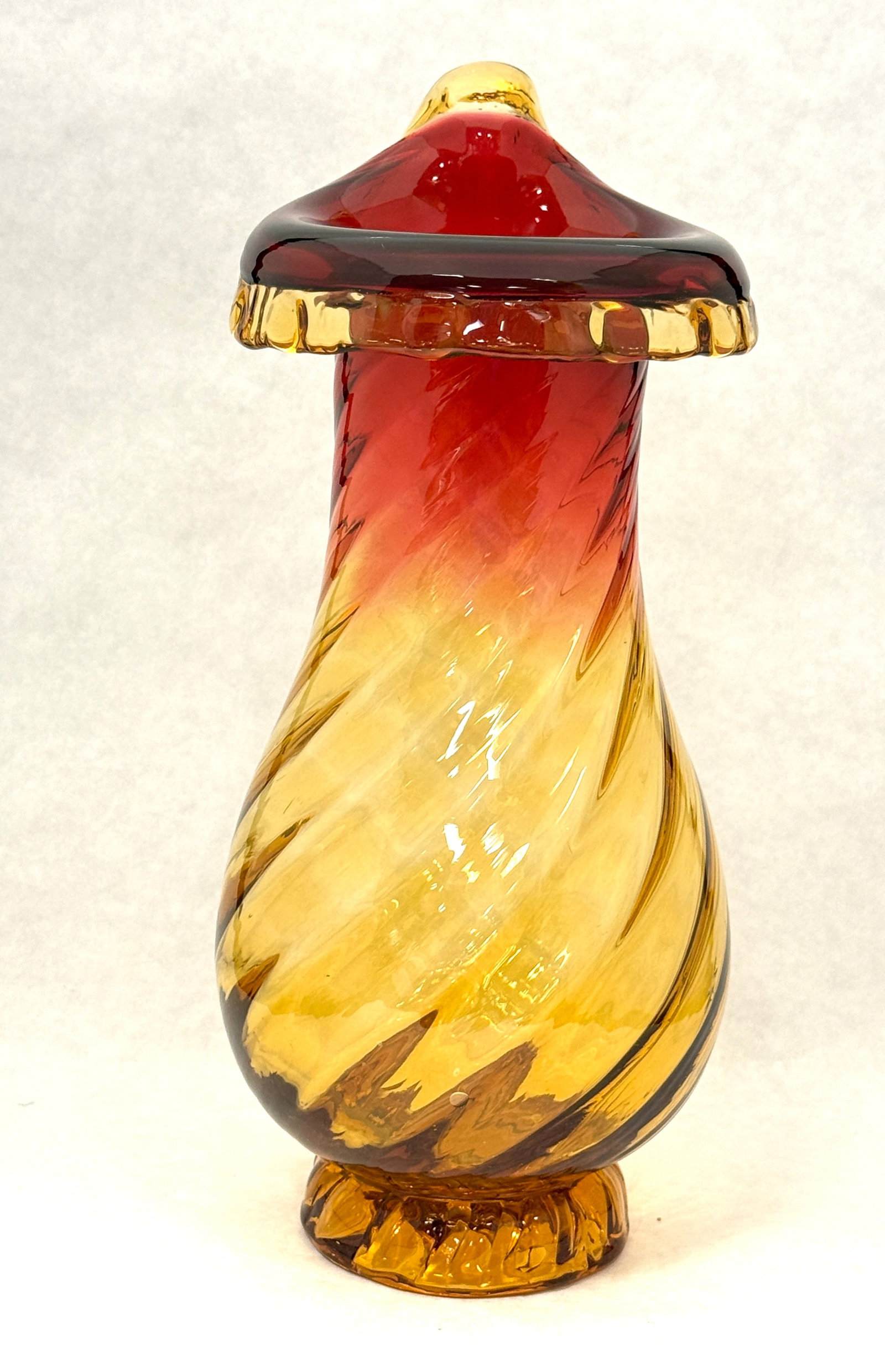 Amberina Swirled Jack Vase: Amberina footed swirled body vase with a Jack-in-the-pulpit top with amber lip wrap, 12" ht. CONDITION: no chips, cracks, repairs, or material defects found, Jaremos attempts to call any material
