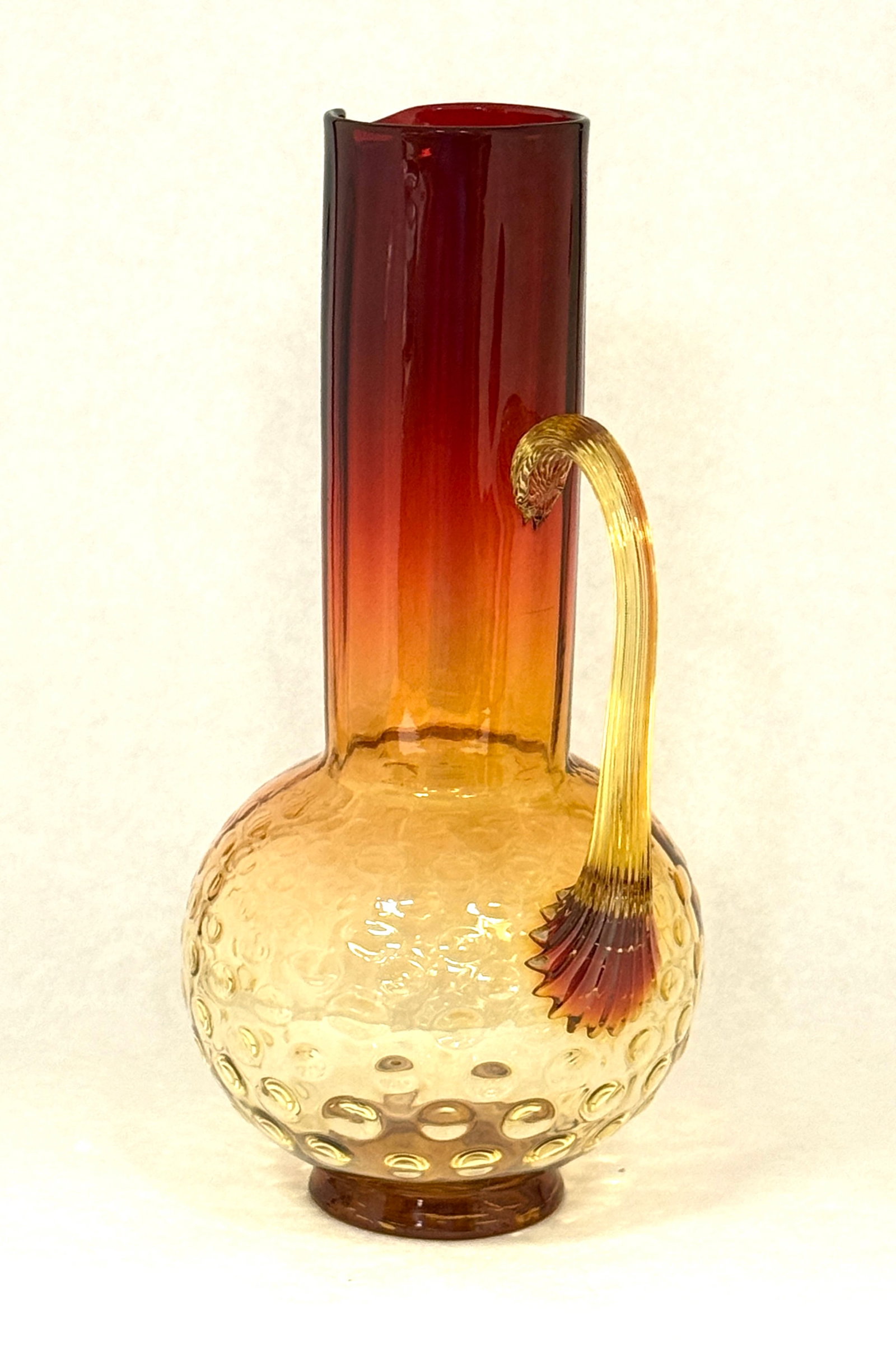 Rare Amberina Fluted Pitcher: Rare Amberina ribbed neck fluted pitcher with a spot optic bulbous bottom, 10" ht. CONDITION: no chips, cracks, repairs, or material defects found, Jaremos attempts to call any material flaw that