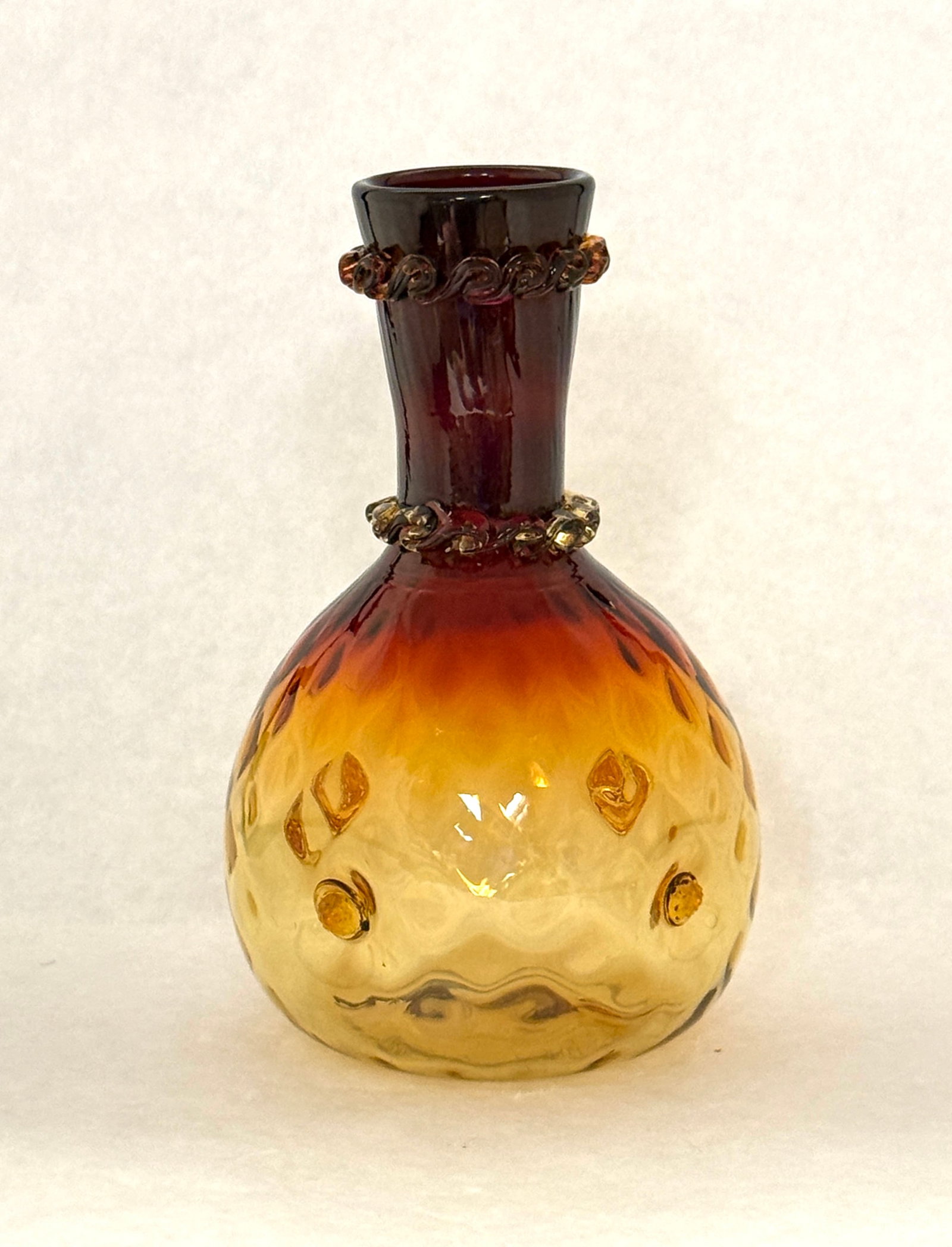 Amberina Rigaree Carafe: New England Amberina dimpled carafe with a double rigaree neck, 8 1/2" ht. CONDITION: no chips, cracks, repairs, or material defects found, Jaremos attempts to call any material flaw that affects the