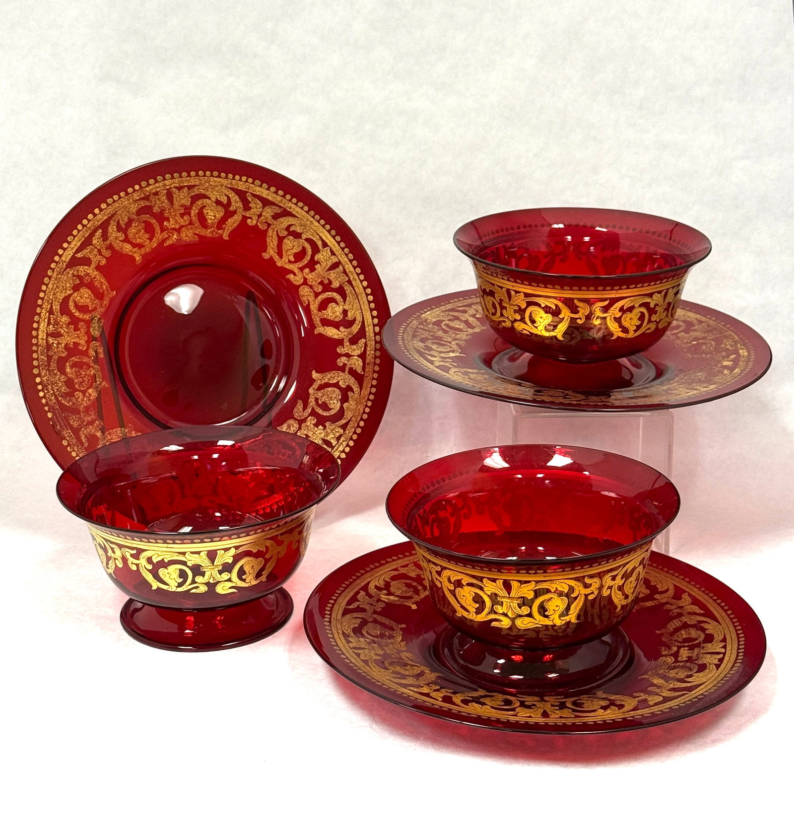 3 Salvietti Bowls and Underplates: 3 Salvietti for Moser cranberry bowls and underplates with gold scrolling enameling; bowl ht. 3", plate diameter 7 5/8". CONDITION: no chips, cracks, repairs, or material defects found, Jaremos