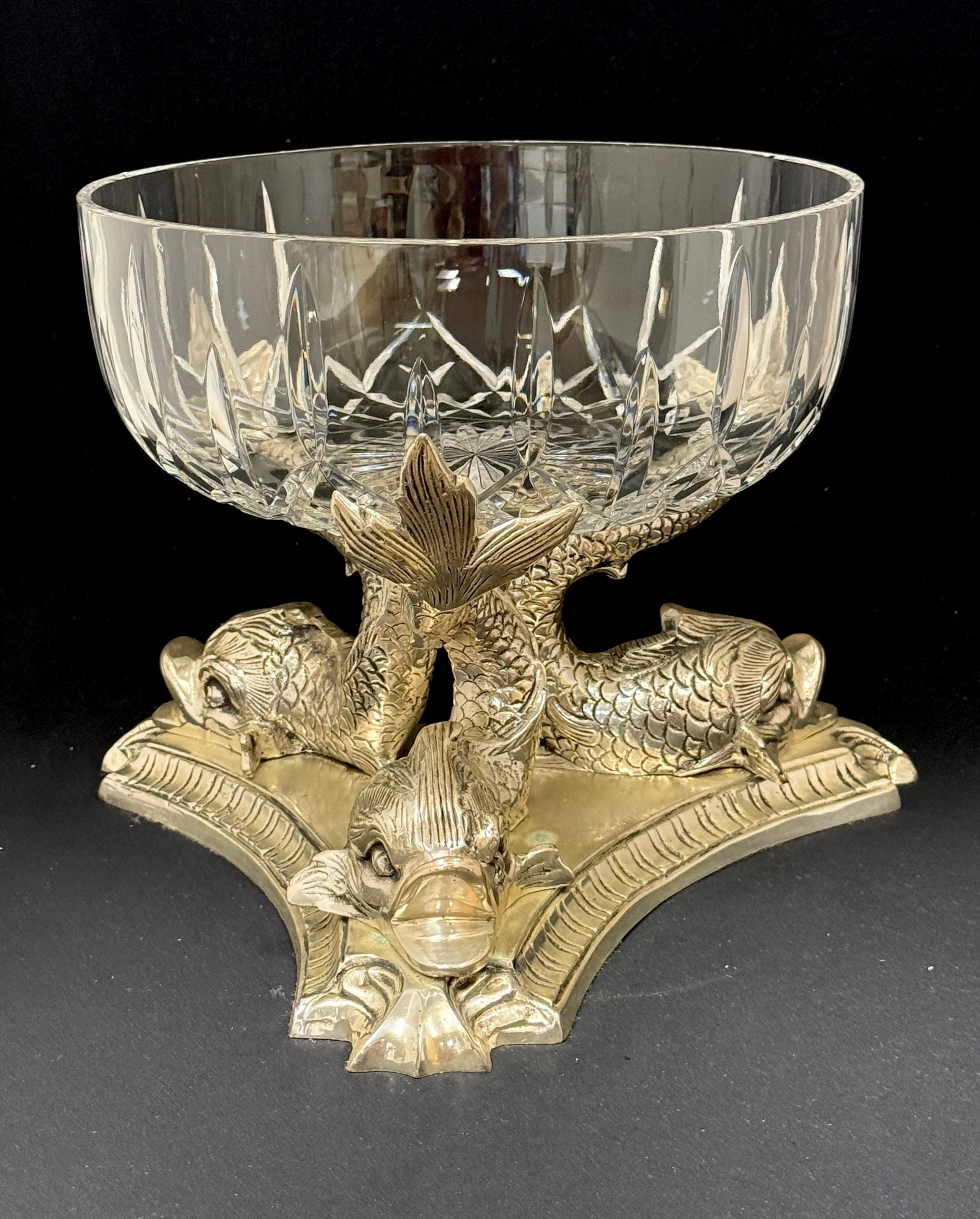 Cut Glass Bowl in Metal Stand: Cut glass bowl in metal stand with dolphin feet; ht. 9 1/4". CONDITION: no chips, cracks, repairs, or material defects found, Jaremos attempts to call any material flaw that affects the price, but