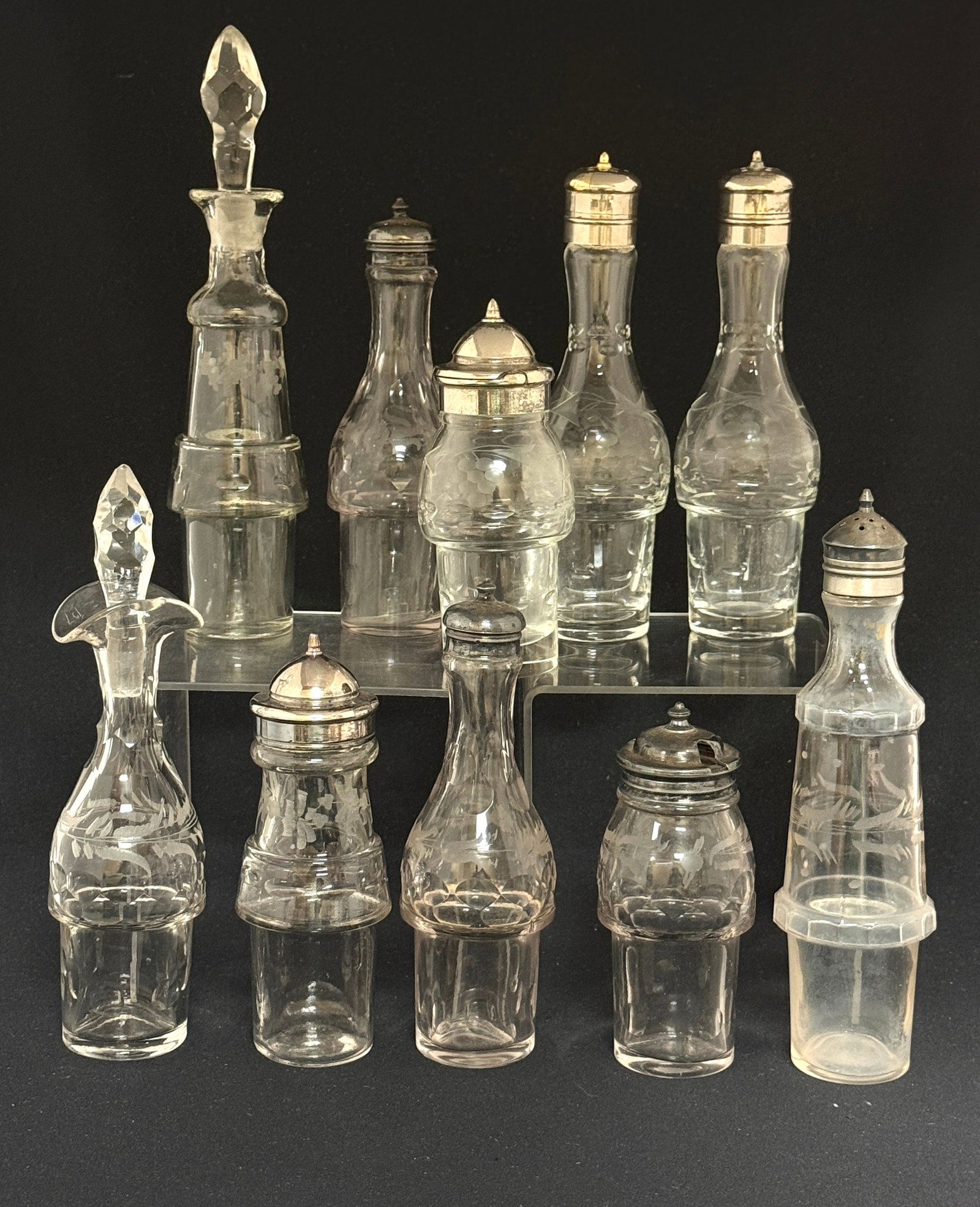 10 Etched Condiment Bottles: 10 etched condiment bottles; tallest 8". CONDITION: no chips, cracks, repairs, or material defects found, Jaremos attempts to call any material flaw that affects the price, but minor scratches and