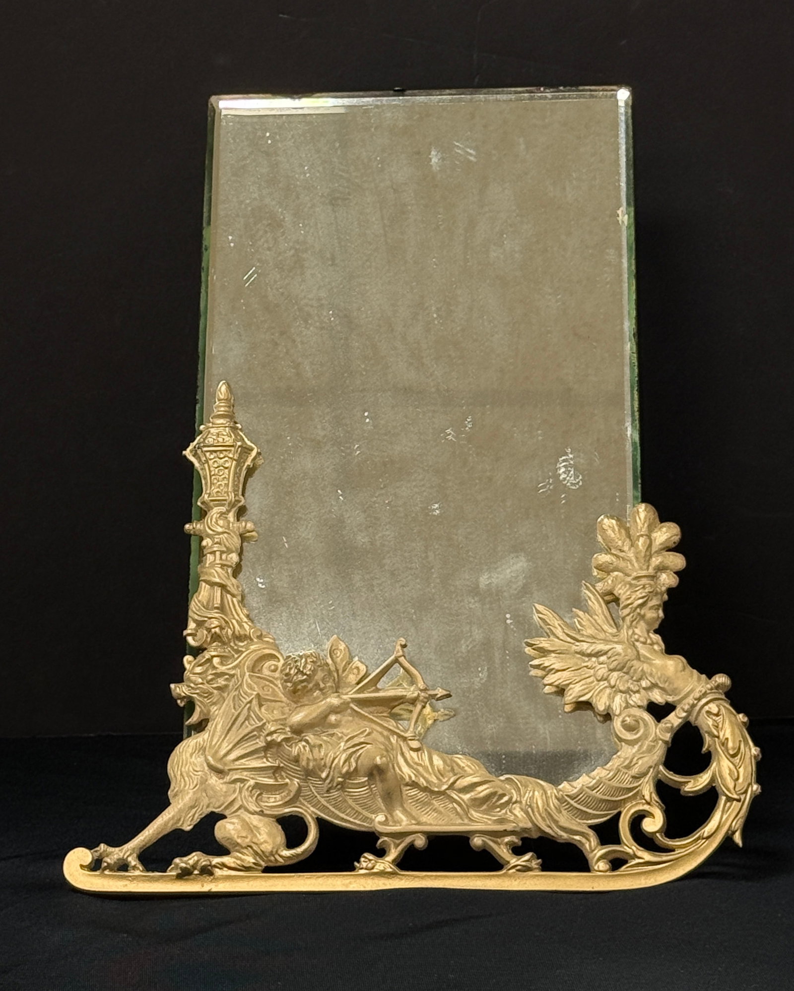 Standup Metal Mirror: Standup metal mirror; ht. 15 1/2". CONDITION: chip to top of mirror.
