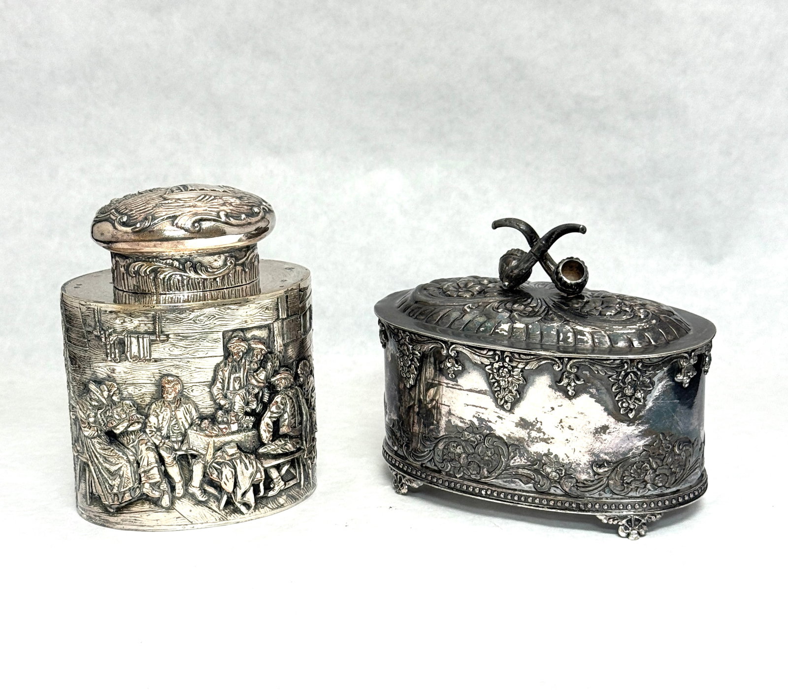 2 Silver Plate Tabacco Tins: 2 silver plate tabacco tins, one stamped Webster; tallest 4 1/2". CONDITION: no chips, cracks, repairs, or material defects found, Jaremos attempts to call any material flaw that affects the price,