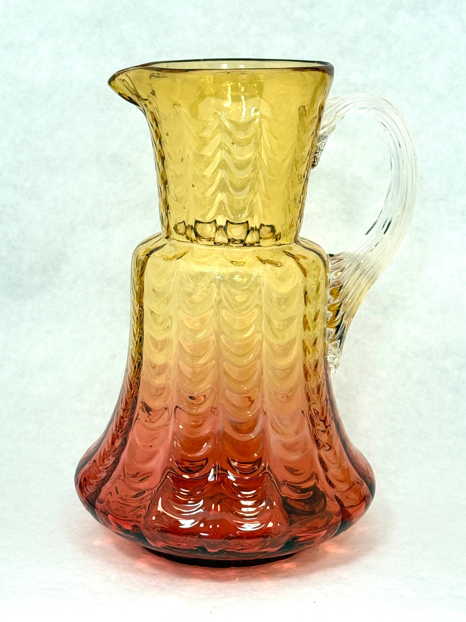 Phoenix Reversed Amberina Water: Phoenix Reversed Amberina Drape Water Pitcher with reeded handle, 10" ht. CONDITION: no chips, cracks, repairs, or material defects found, Jaremos attempts to call any material flaw that affects the