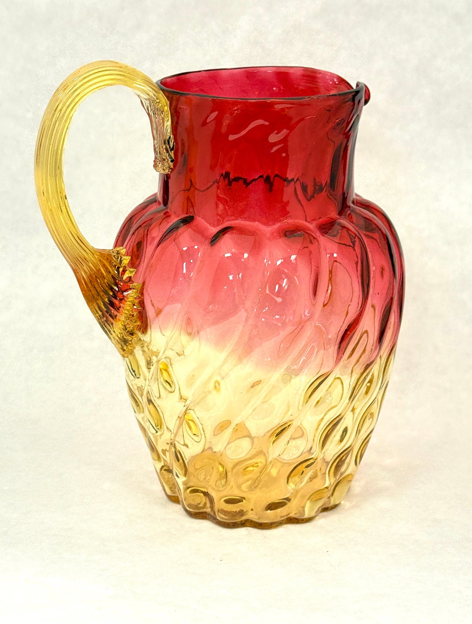 Amberina Swirl Optic Pitcher: Amberina Swirl Optic Water Pitcher, 8 3/4" ht. CONDITION: no chips, cracks, repairs, or material defects found, Jaremos attempts to call any material flaw that affects the price, but minor scratches