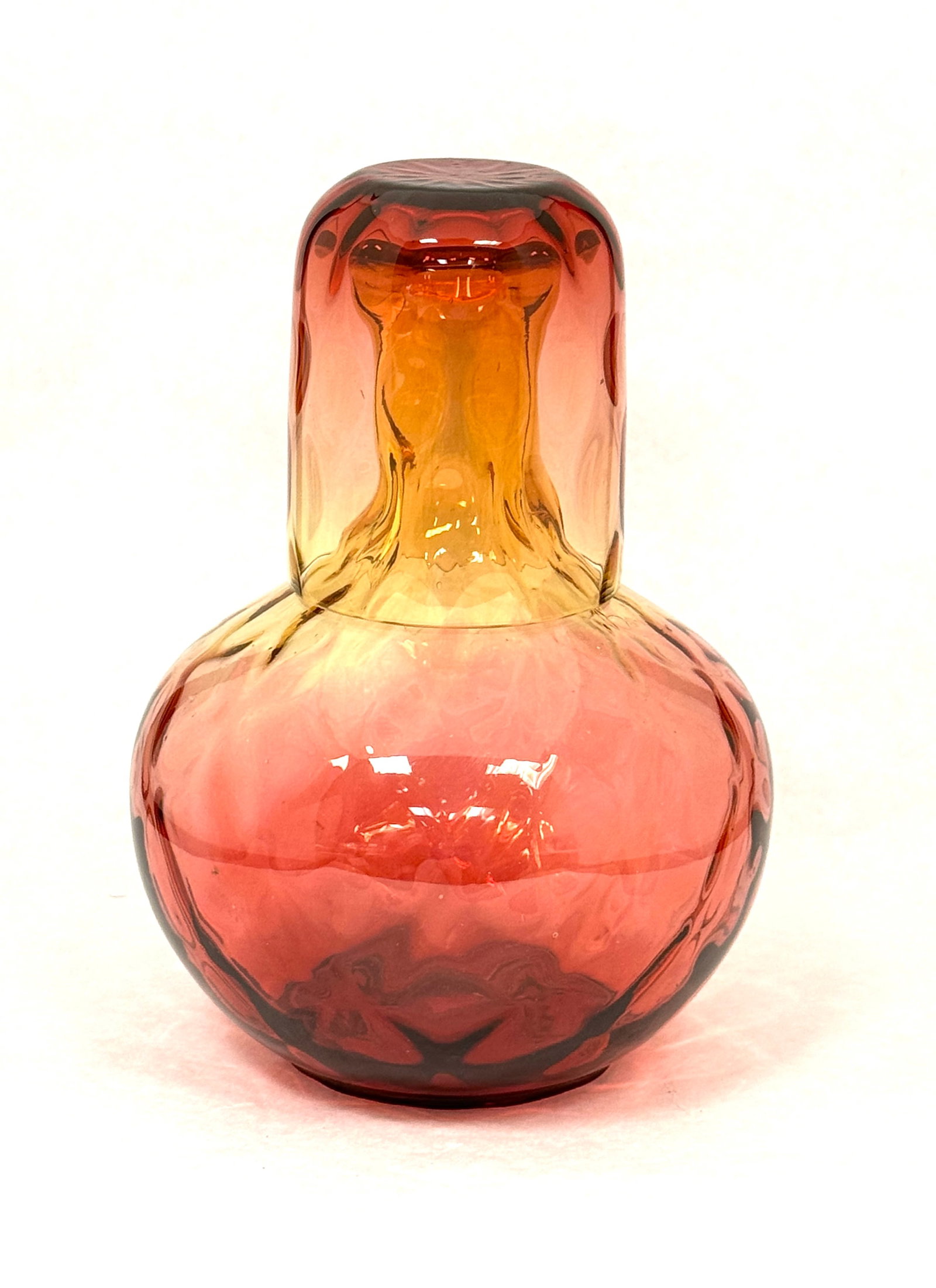 Reverse Amberina Tumble Up: Reverse Amberina tumble up with an Optic Diamond bottle and an Optic Thumbprint tumbler, 8" ht. CONDITION: no chips, cracks, repairs, or material defects found, Jaremos attempts to call any material