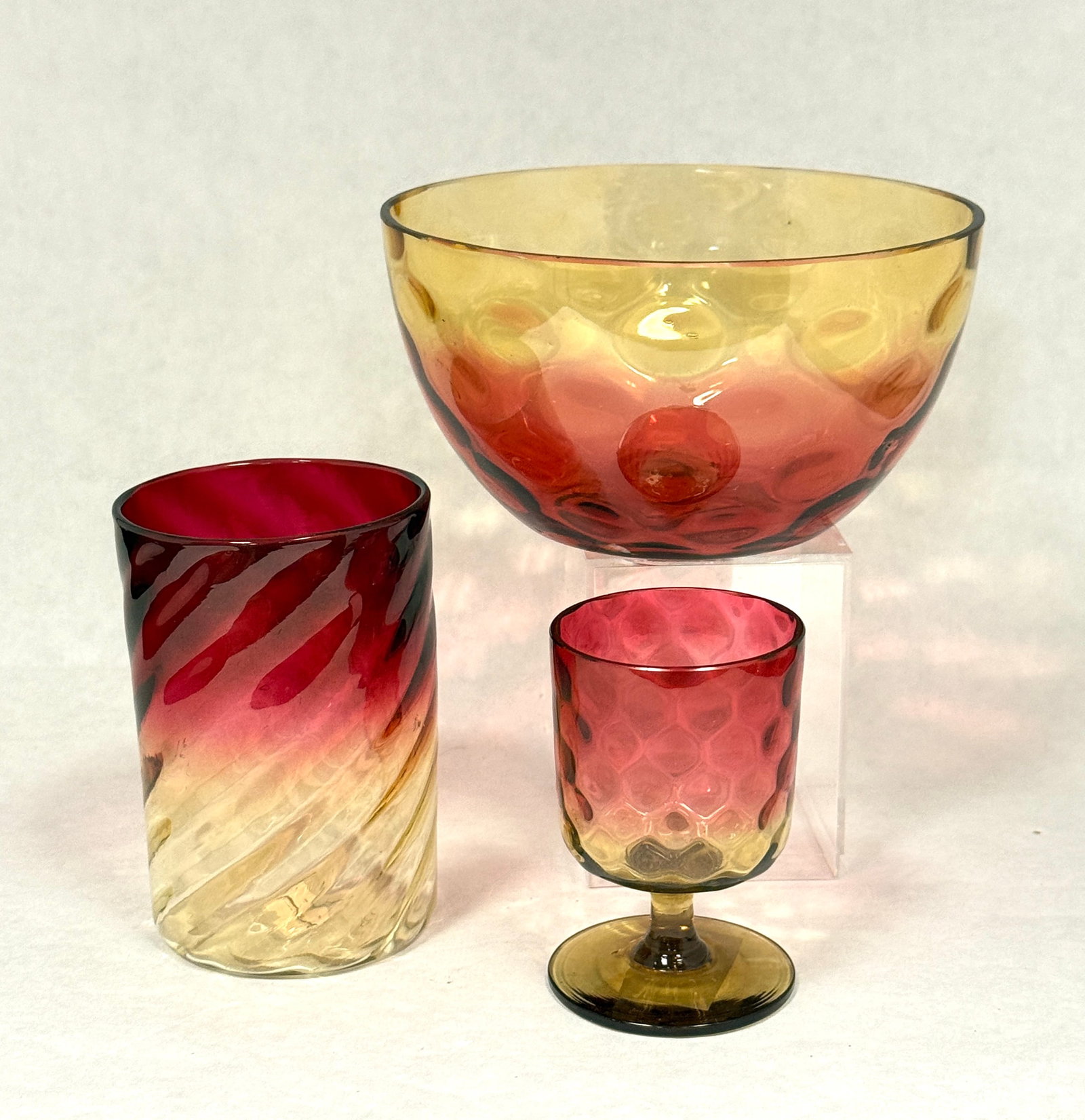 3 Amberina Items: 3 Amberina items including bowl, cordial, and swirl tumbler; tallest ht. 3 3/4". CONDITION: no chips, cracks, repairs, or material defects found, Jaremos attempts to call any material flaw that