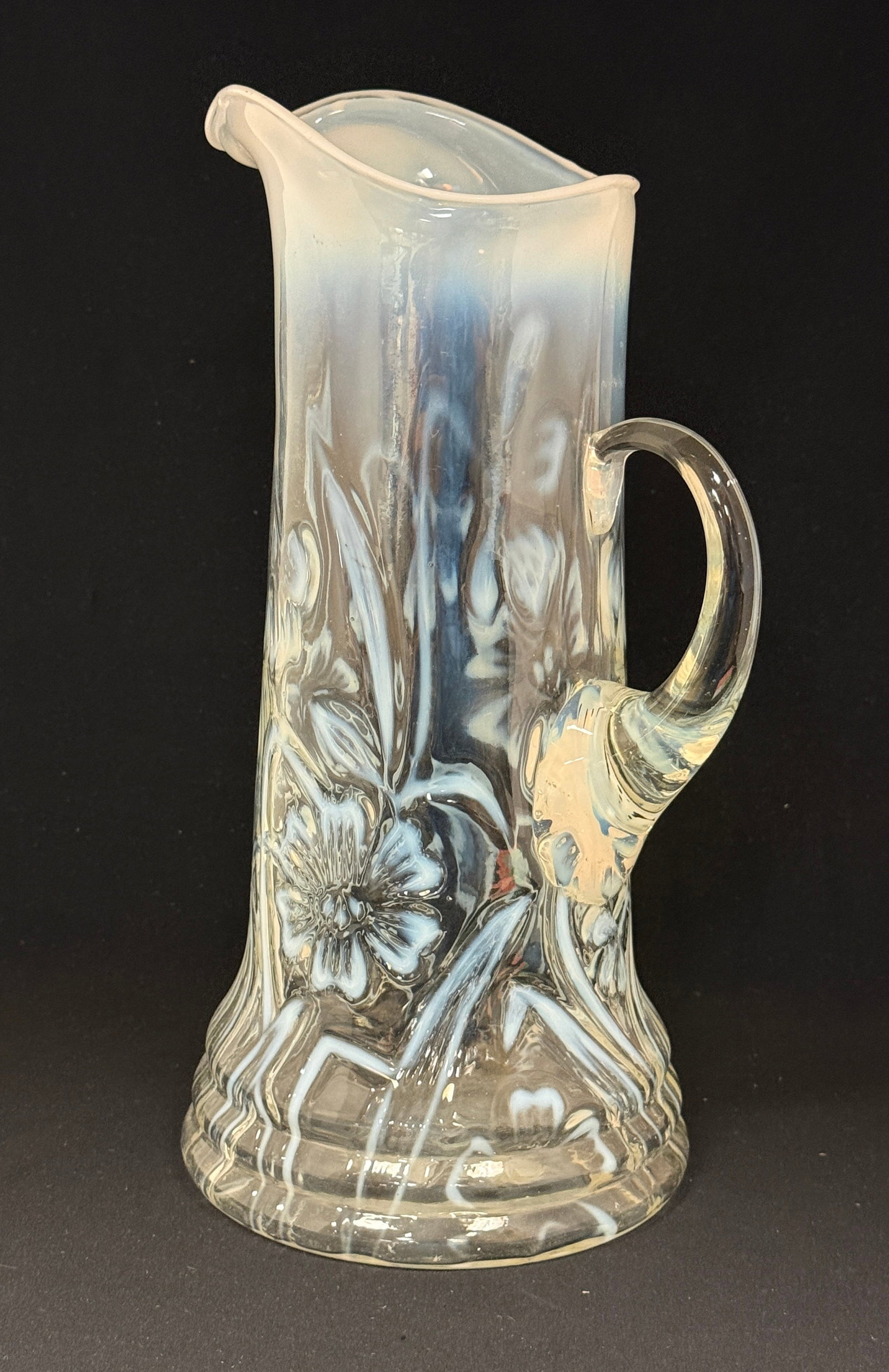 White Opalescent Daffodil Tankard: White opalescent daffodil tankard; ht. 12". CONDITION: no chips, cracks, repairs, or material defects found, Jaremos attempts to call any material flaw that affects the price, but minor scratches and 