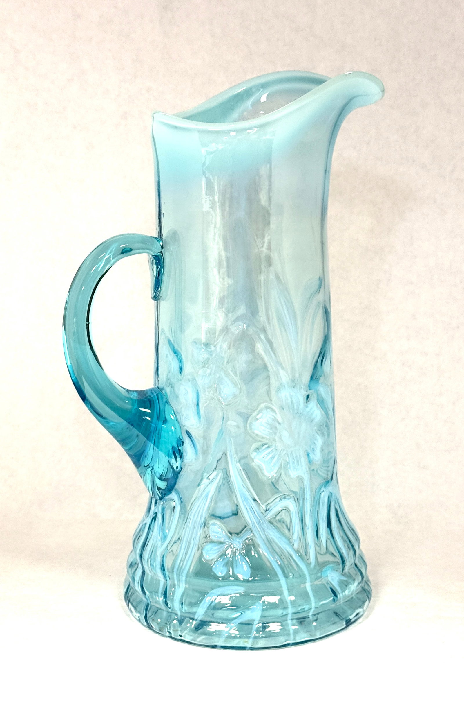 Opalescent Daffodil Tankard: Opalescent blue daffodil tankard; ht. 11 7/8". CONDITION: no chips, cracks, repairs, or material defects found, Jaremos attempts to call any material flaw that affects the price, but minor scratches a