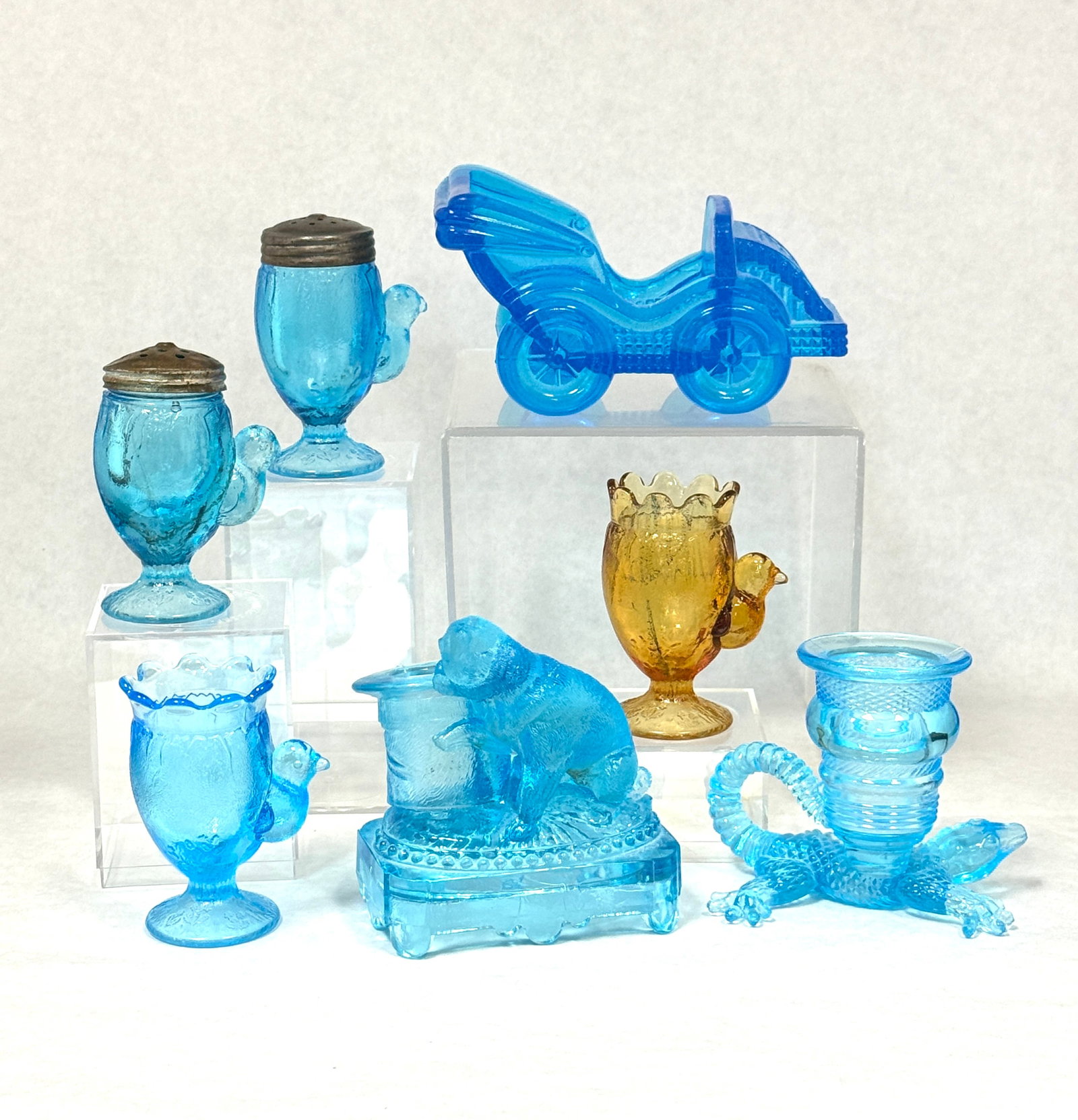 Group of 7 EAPG items: Group of Early American Pattern Glass including a dog toothpick, lizard toothpick, early bird shakers and toothpick and a car, tallest 3 1/2" ht. CONDITION: no chips, cracks, repairs, or material