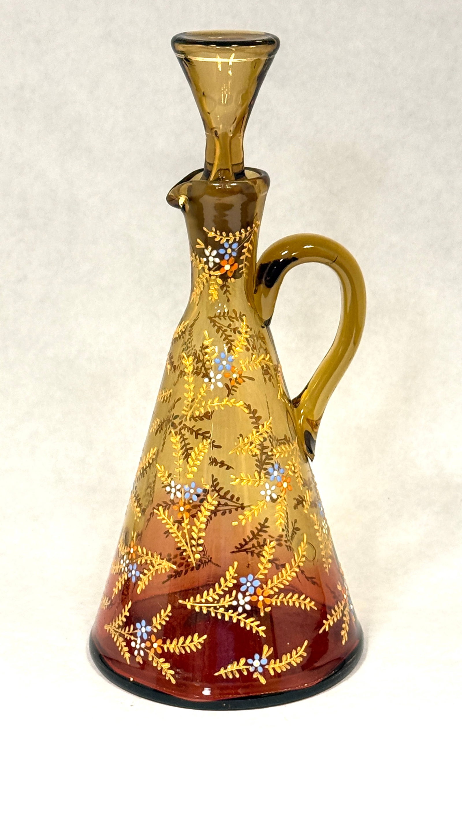Moser Amberina Tepee Cruet: Moser reverse Amberina tepee tall cruet with enameled flowers; ht. 8 1/2". CONDITION: no chips, cracks, repairs, or material defects found, Jaremos attempts to call any material flaw that affects the
