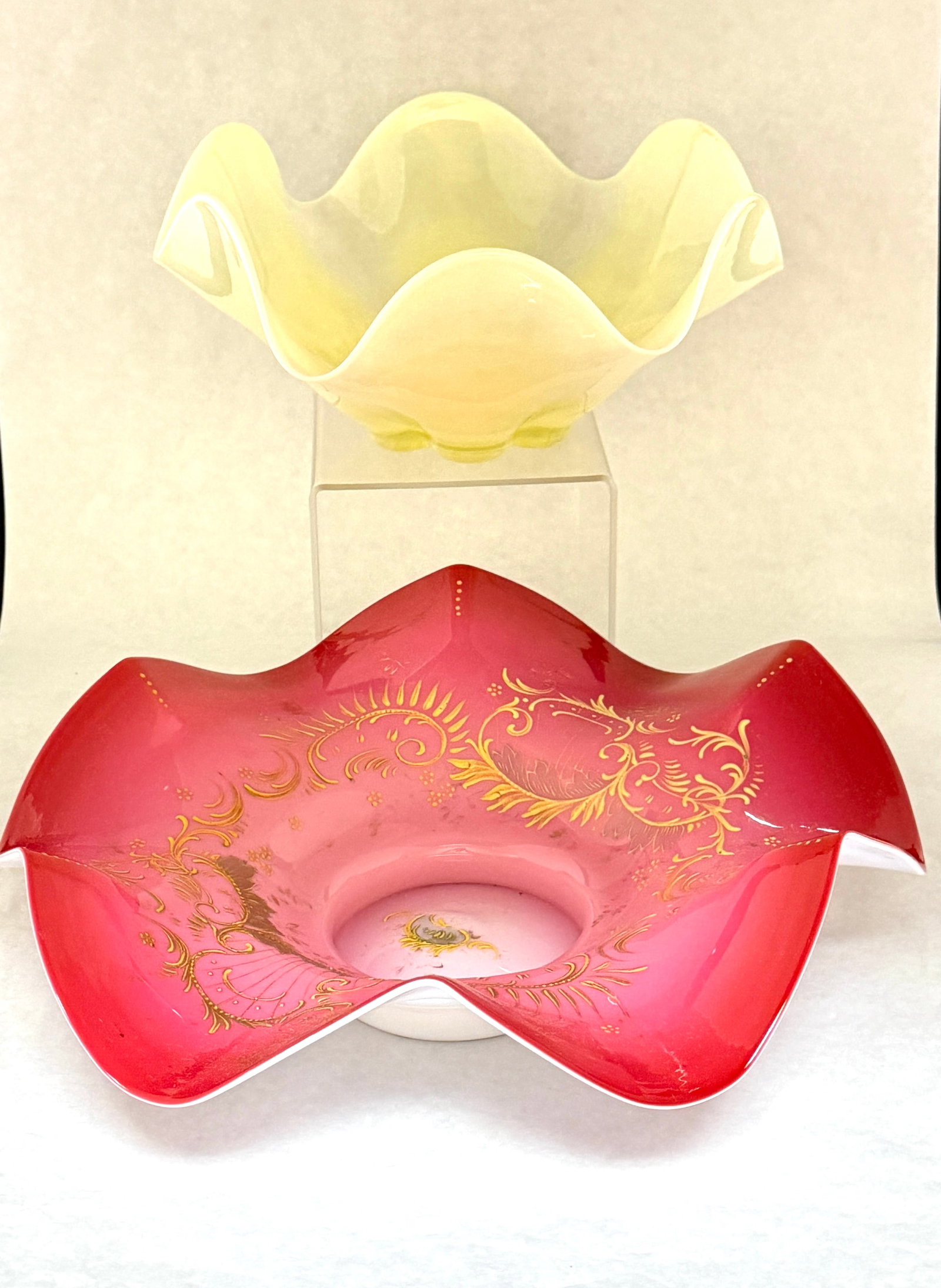 2 Victorian Bride's Bowls: 2 Victorian bride's bowls including a pink satin glass bowl with enameled flowers together with a vaseline bowl, largest 13 1/2" wide. CONDITION: no chips, cracks, repairs, or material defects found,