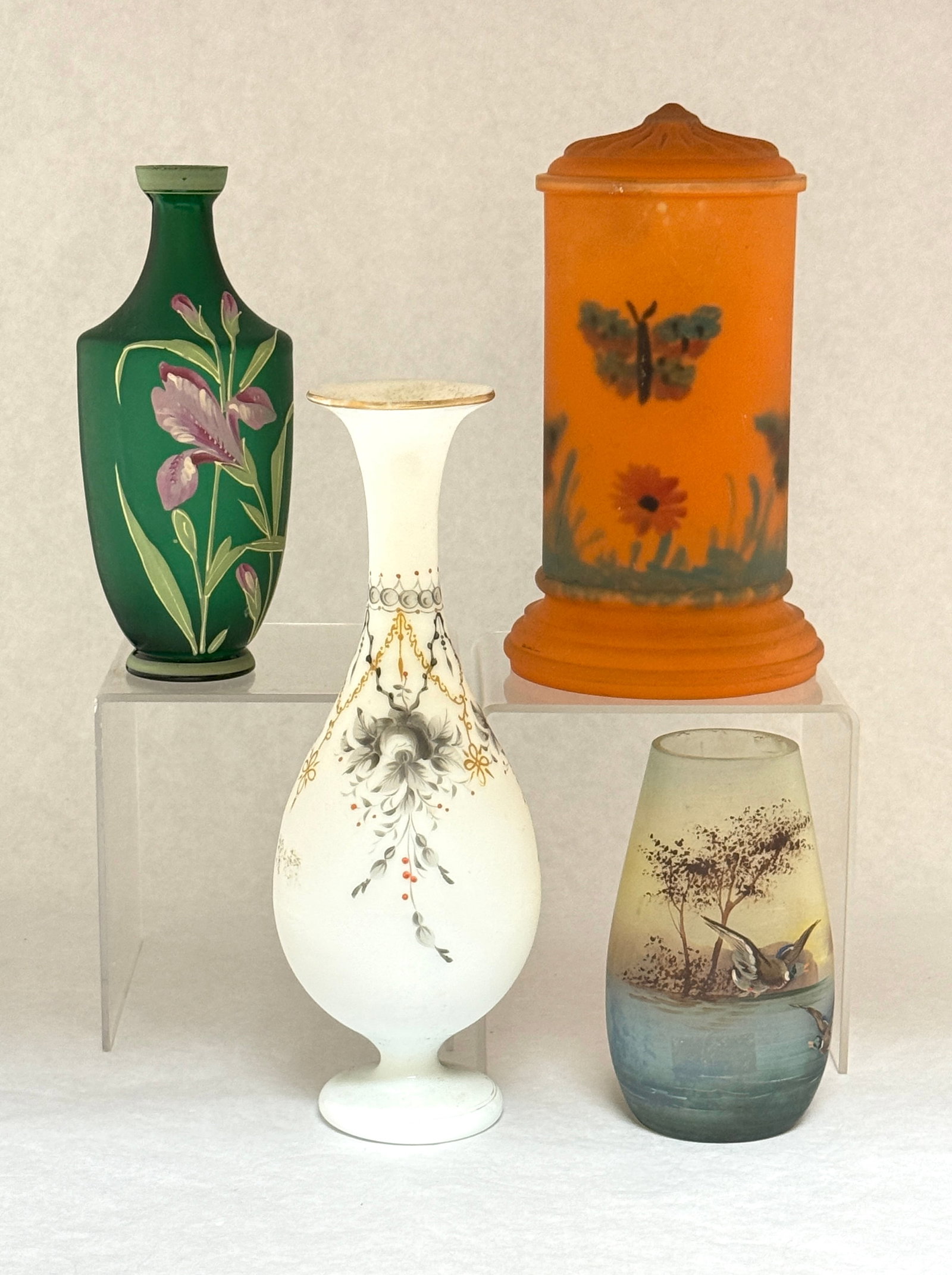 4 Victorian Enameled Items: 4 Victorian enameled items including a green satin glass vase with flowers, an opaline with blue flowers and gilt highlights, a lake scene with birds and a candle lamp shade with butterflies, tallest