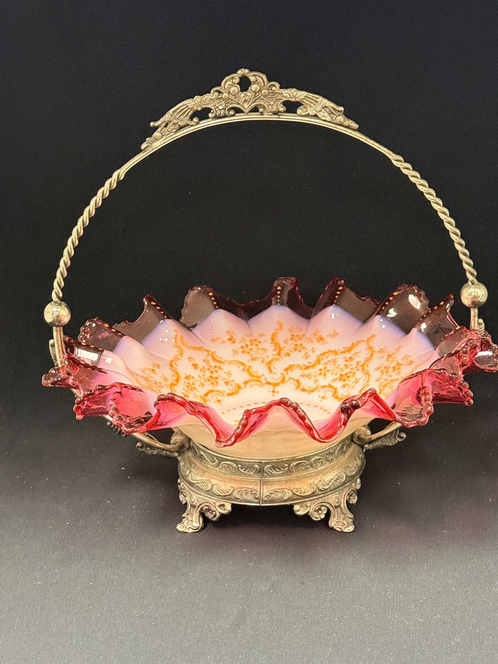 Opalescent Bride's Bowl: Opalescent cranberry bride's bowl in associated stand; diameter 11". CONDITION: no chips, cracks, repairs, or material defects found, Jaremos attempts to call any material flaw that affects the price,
