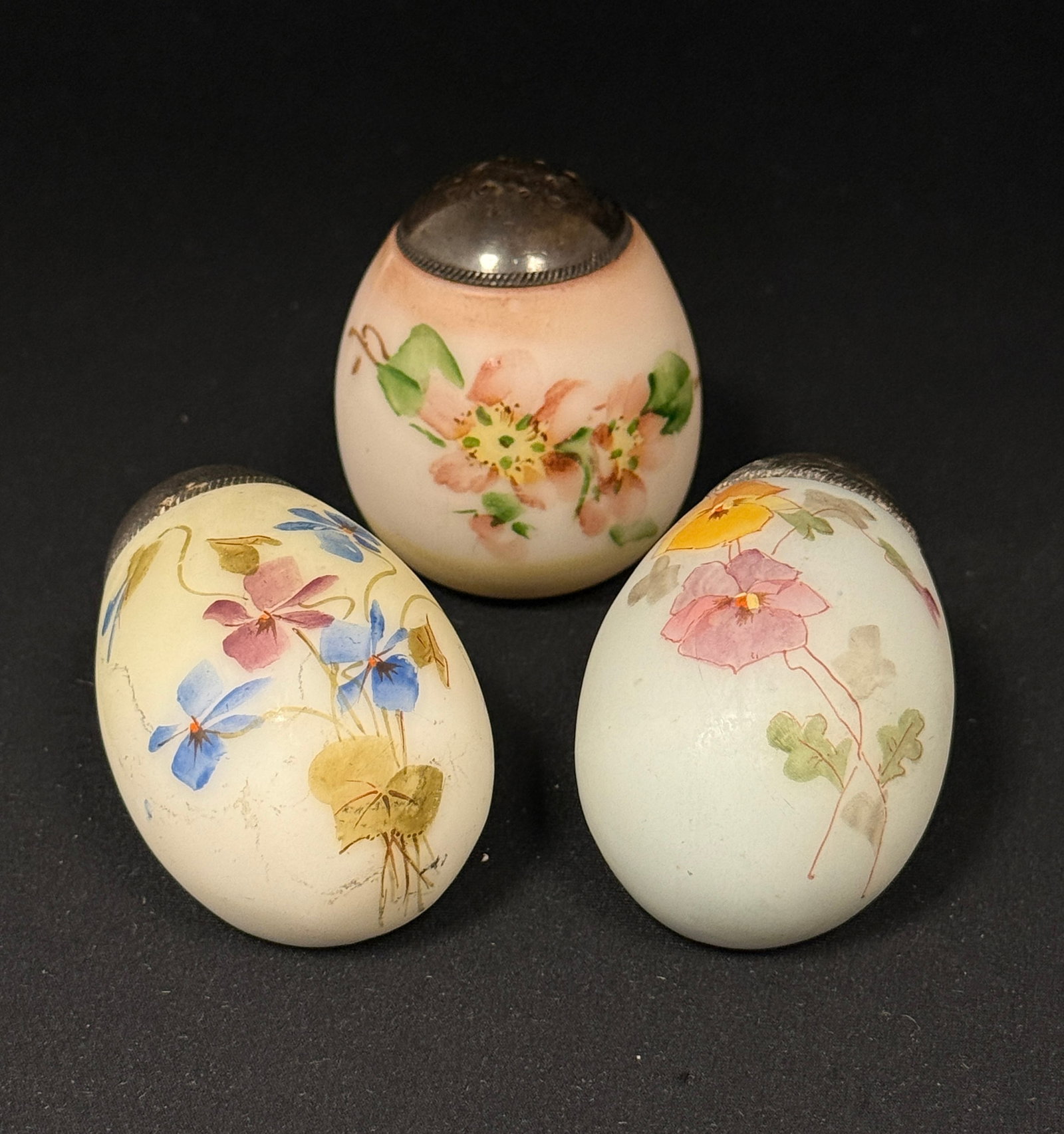 3 Mt. Washington Egg Shakers: 2 Mt. Washington laydown salt shakers and 1 standup shaker; length 2 3/4". CONDITION: no chips, cracks, repairs, or material defects found, Jaremos attempts to call any material flaw that affects the