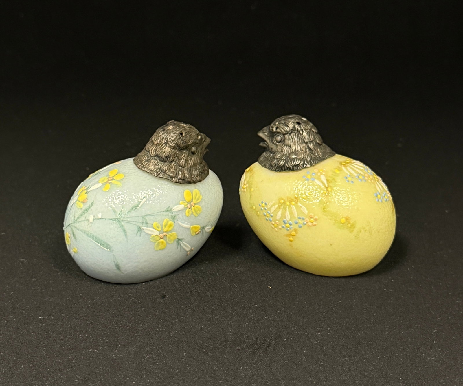 2 Mt. Washington Chick Salts: 2 Mt. Washington sitting chick salt shakers one yellow one blue; length 2 1/2". CONDITION: no chips, cracks, repairs, or material defects found, Jaremos attempts to call any material flaw that