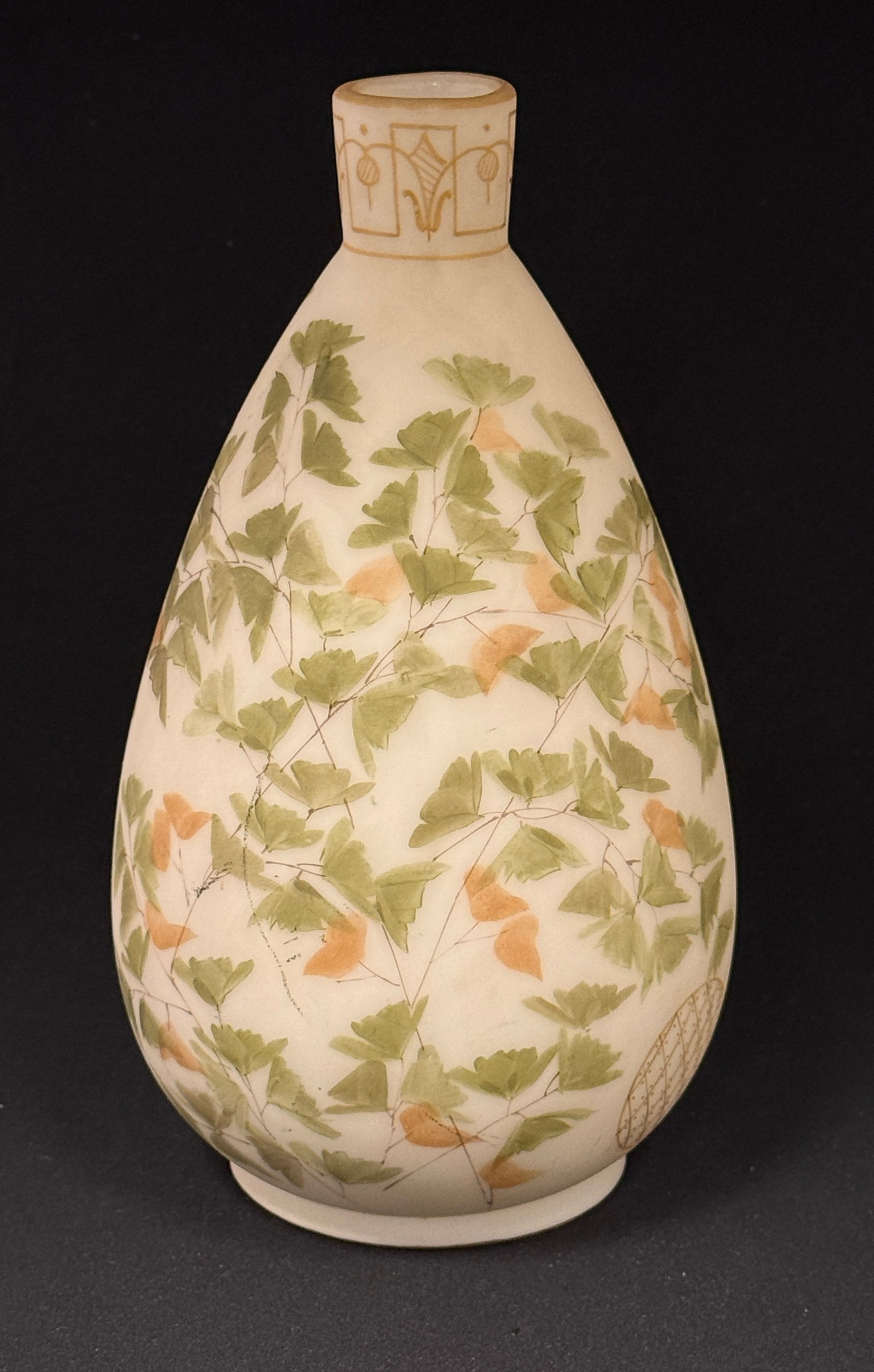 Mt. Washington Vase: Mt. Washington Crown Milano ovoid vase in cream colored glass decorated with green and red Gingko, 9 1/2" ht. CONDITION: no chips, cracks, repairs, or material defects found, Jaremos attempts to call