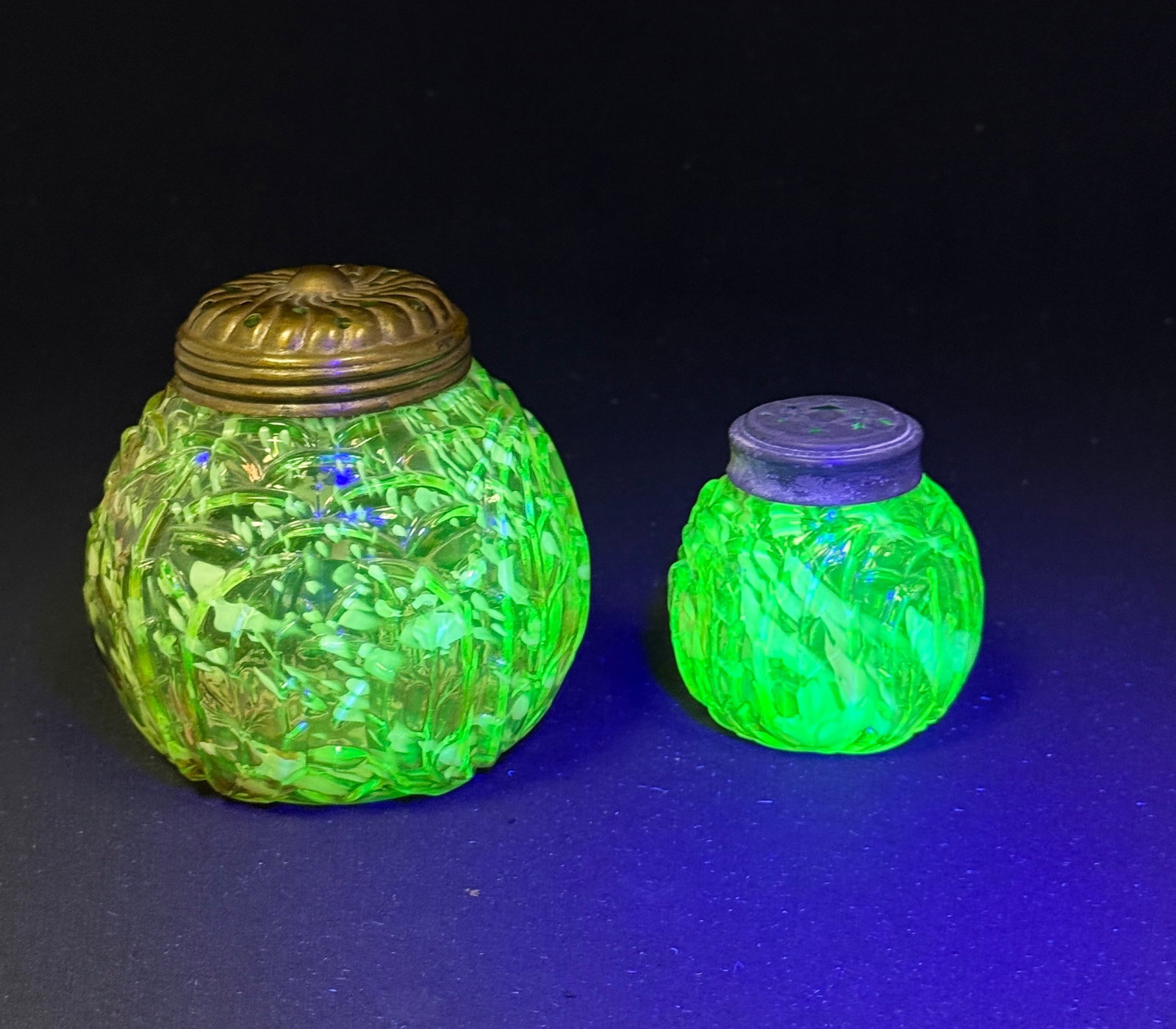 2 Vaseline Splatter Items: 2 Northwood Vaseline leaf mold splatter salt and sugar; ht. 4 1/2". CONDITION: no chips, cracks, repairs, or material defects found, Jaremos attempts to call any material flaw that affects the price, 