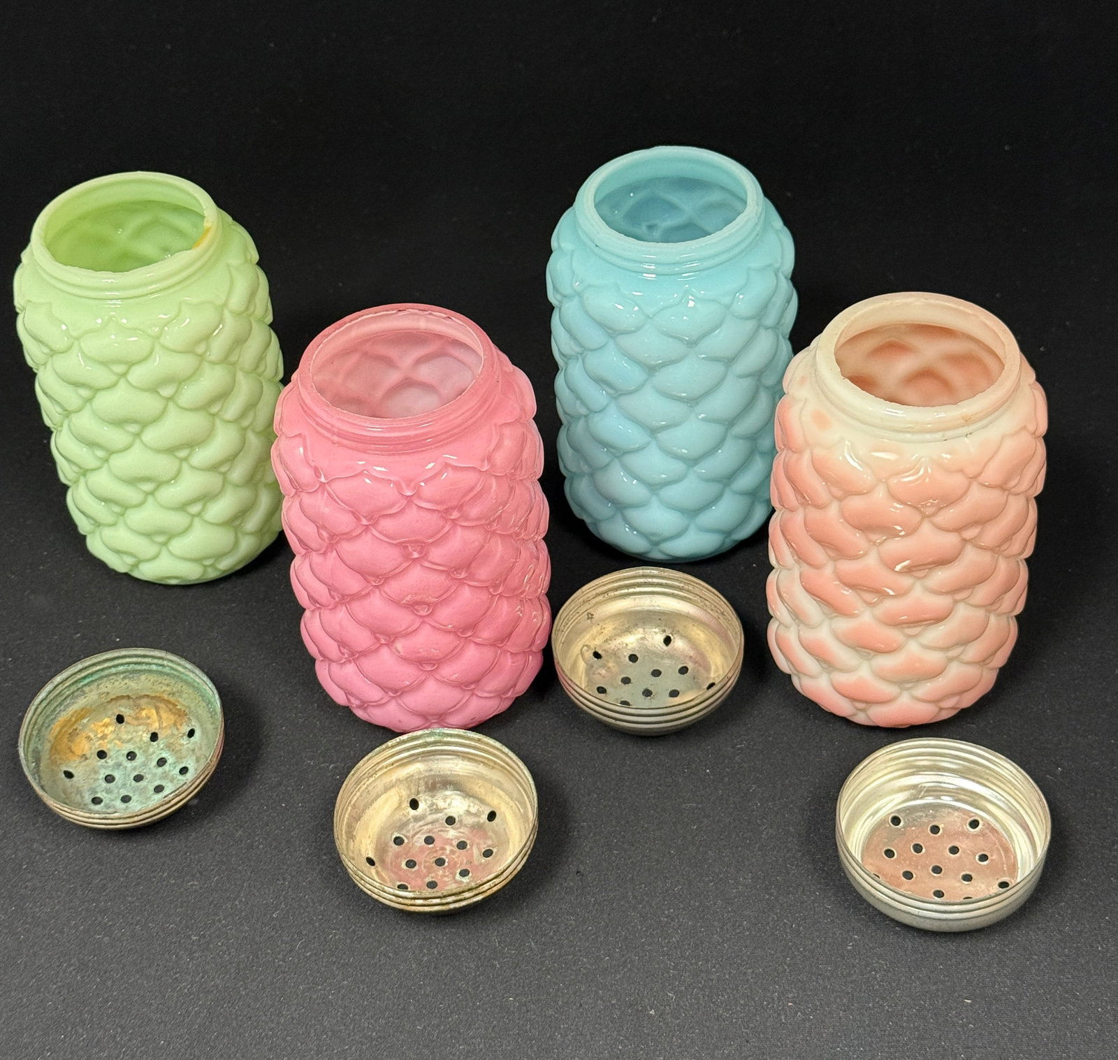 4 Cone Sugar Shakers: 4 Consolidated cone sugar shakers one blue, one pink, one green, and one pink and white; ht. 5". CONDITION: no chips, cracks, repairs, or material defects found, Jaremos attempts to call any material