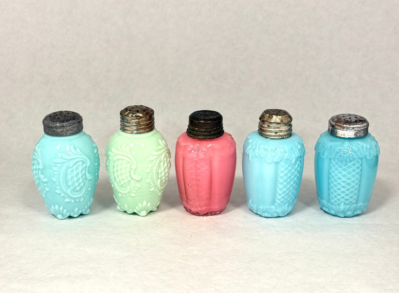 5 EAPG salt shakers: 5 Early American Pattern Glass salt shakers including 2 Dithridge Pineapple and 3 scroll and nut, tallest 3" ht CONDITION: no chips, cracks, repairs, or material defects found, Jaremos attempts to cal