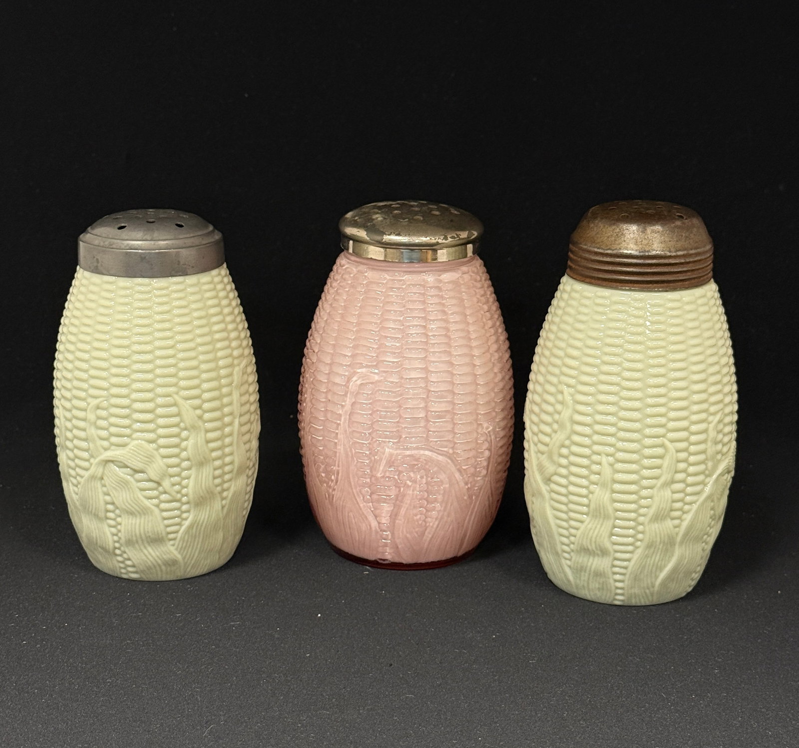 3 Opaque Corn Shakers: 3 Opaque corn sugar shakers, 2 green, one pink; ht. 6". CONDITION: no chips, cracks, repairs, or material defects found, Jaremos attempts to call any material flaw that affects the price, but minor sc