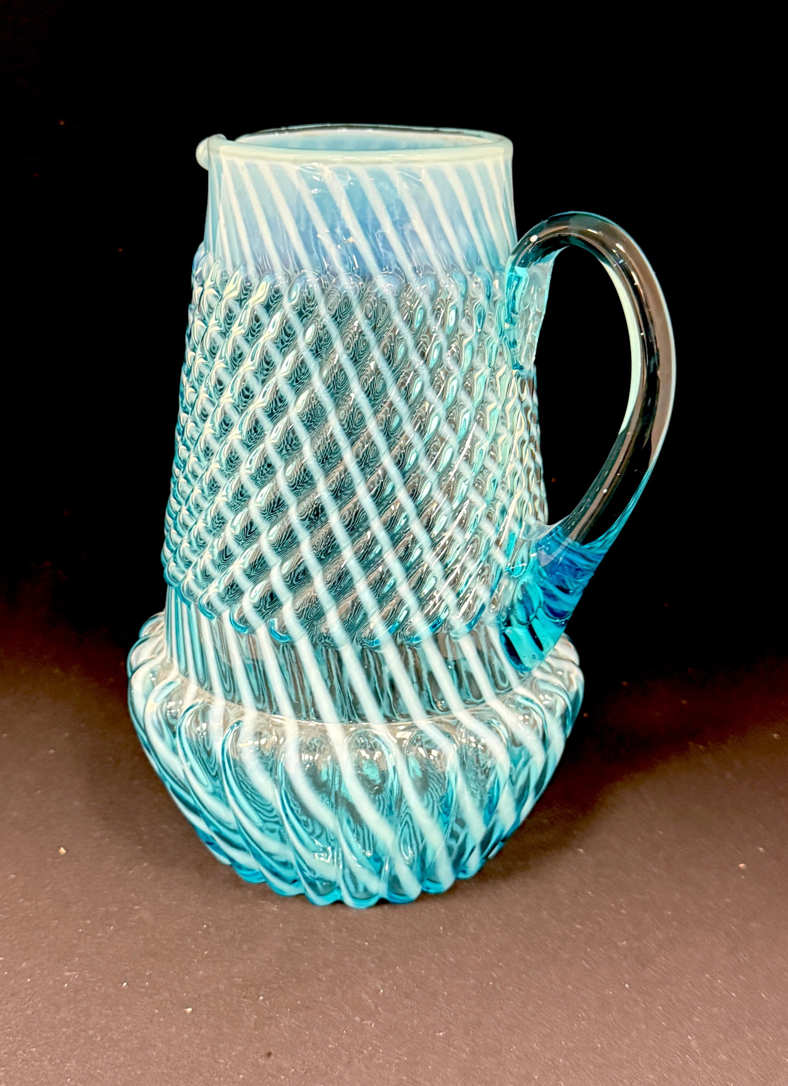 Chrysanthemum Base Pitcher: Northwood Chrysanthemum base blue swirl pitcher, 9" ht. CONDITION: no chips, cracks, repairs, or material defects found, Jaremos attempts to call any material flaw that affects the price, but minor sc