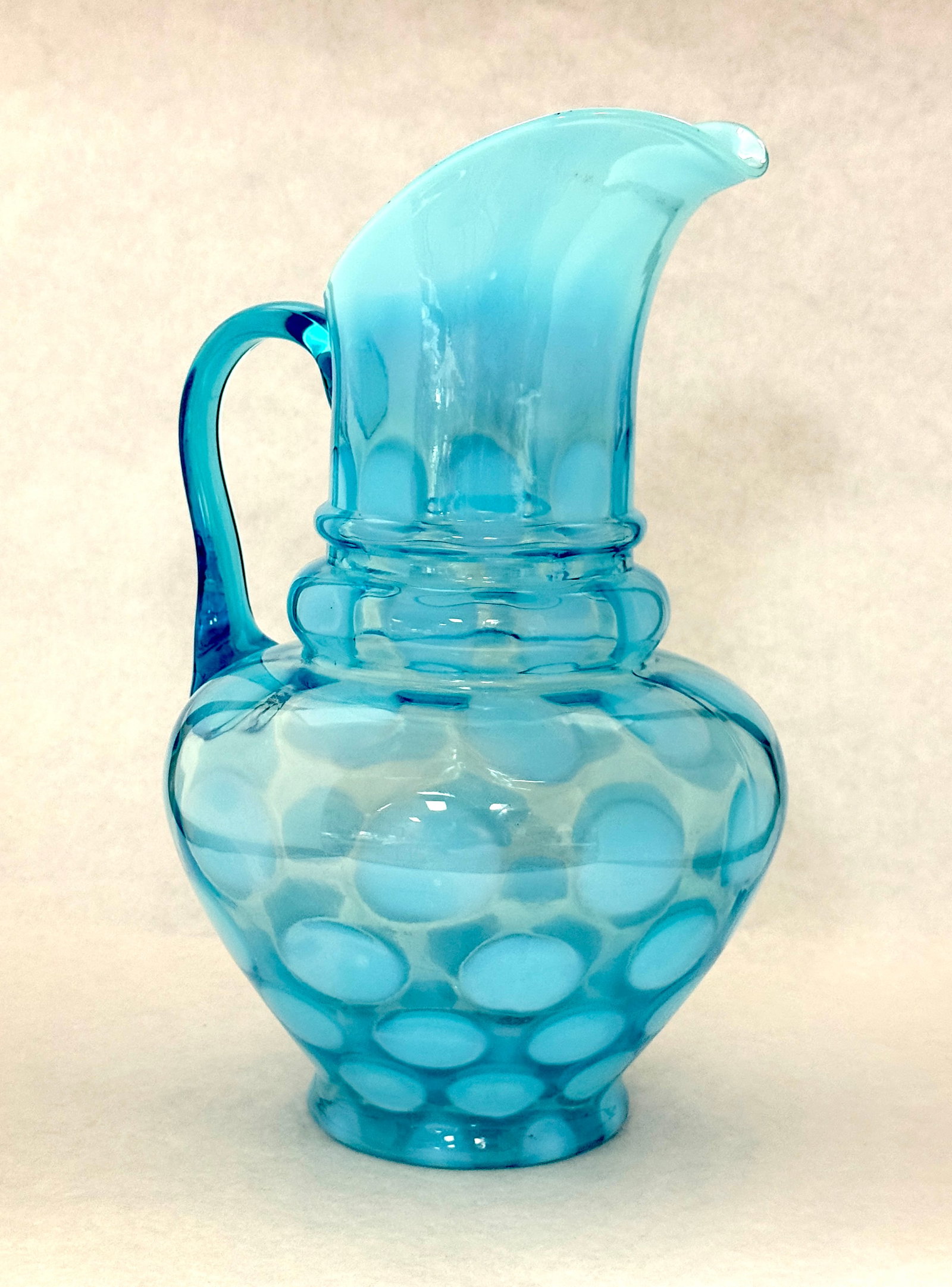 Opalescent Blue Coin Spot Pitcher: Opalescent blue coin spot 3 tier pitcher; ht. 11 1/4". CONDITION: no chips, cracks, repairs, or material defects found, Jaremos attempts to call any material flaw that affects the price, but minor