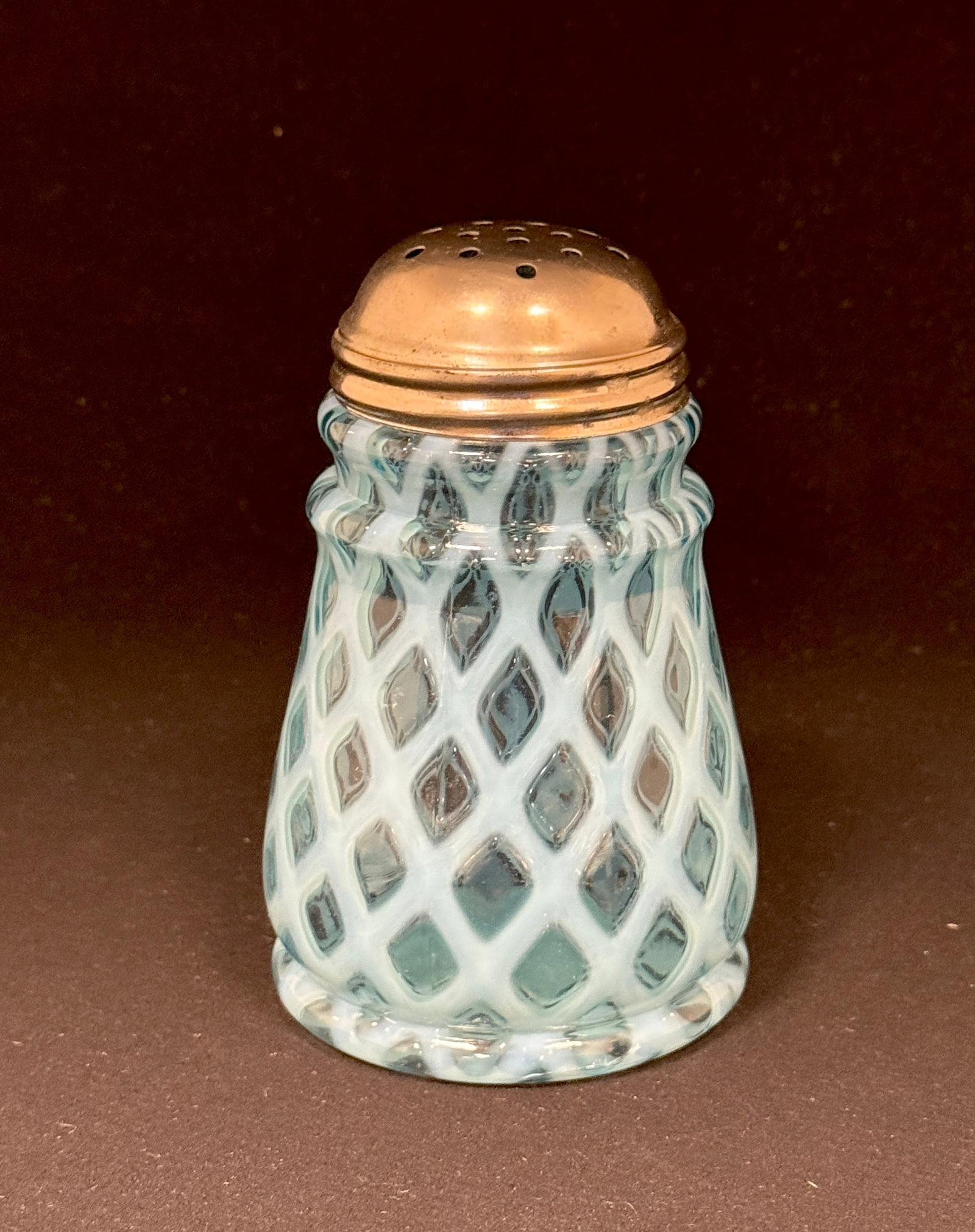 Opalescent Lattice Shaker: Opalescent tapered lattice sugar shaker in blue; ht. 6". CONDITION: no chips, cracks, repairs, or material defects found, Jaremos attempts to call any material flaw that affects the price, but minor s