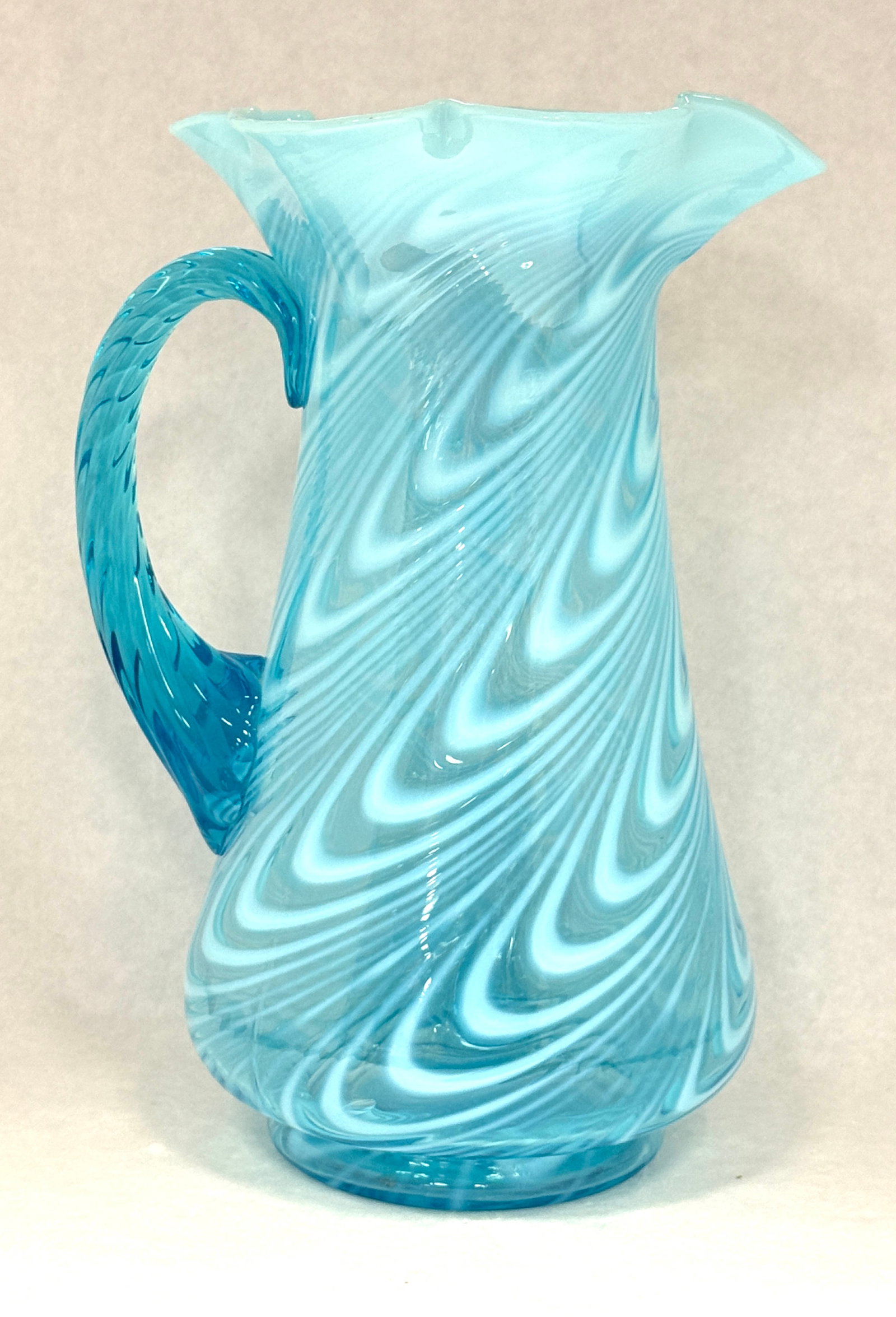 Opalescent Twist Tankard: Opalescent blue twist tankard; ht. 10 1/2". CONDITION: no chips, cracks, repairs, or material defects found, Jaremos attempts to call any material flaw that affects the price, but minor scratches and