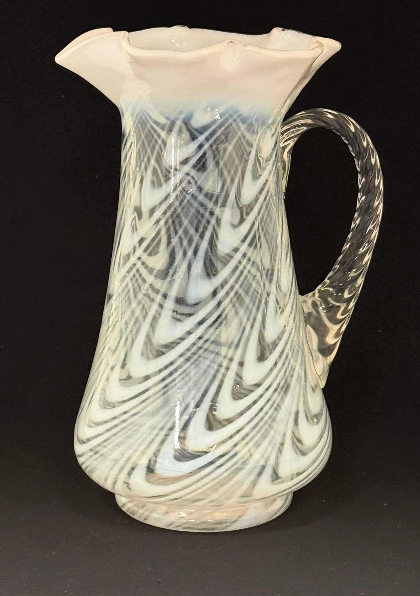 Opalescent Twist Tankard: Opalescent white twist tankard; ht. 10 1/2". CONDITION: no chips, cracks, repairs, or material defects found, Jaremos attempts to call any material flaw that affects the price, but minor scratches and