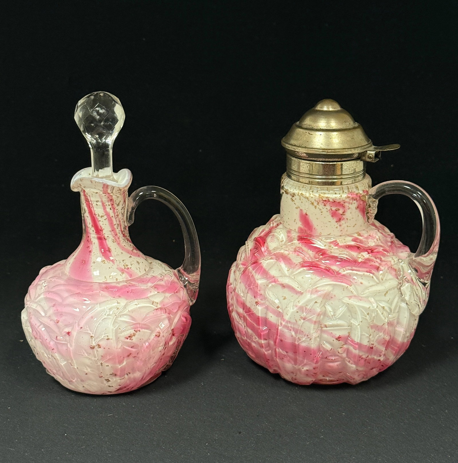 Opalescent Splatter Items: Opalescent leaf mold cranberry splatter cruet and syrup; ht. 6 1/2". CONDITION: no chips, cracks, repairs, or material defects found, Jaremos attempts to call any material flaw that affects the