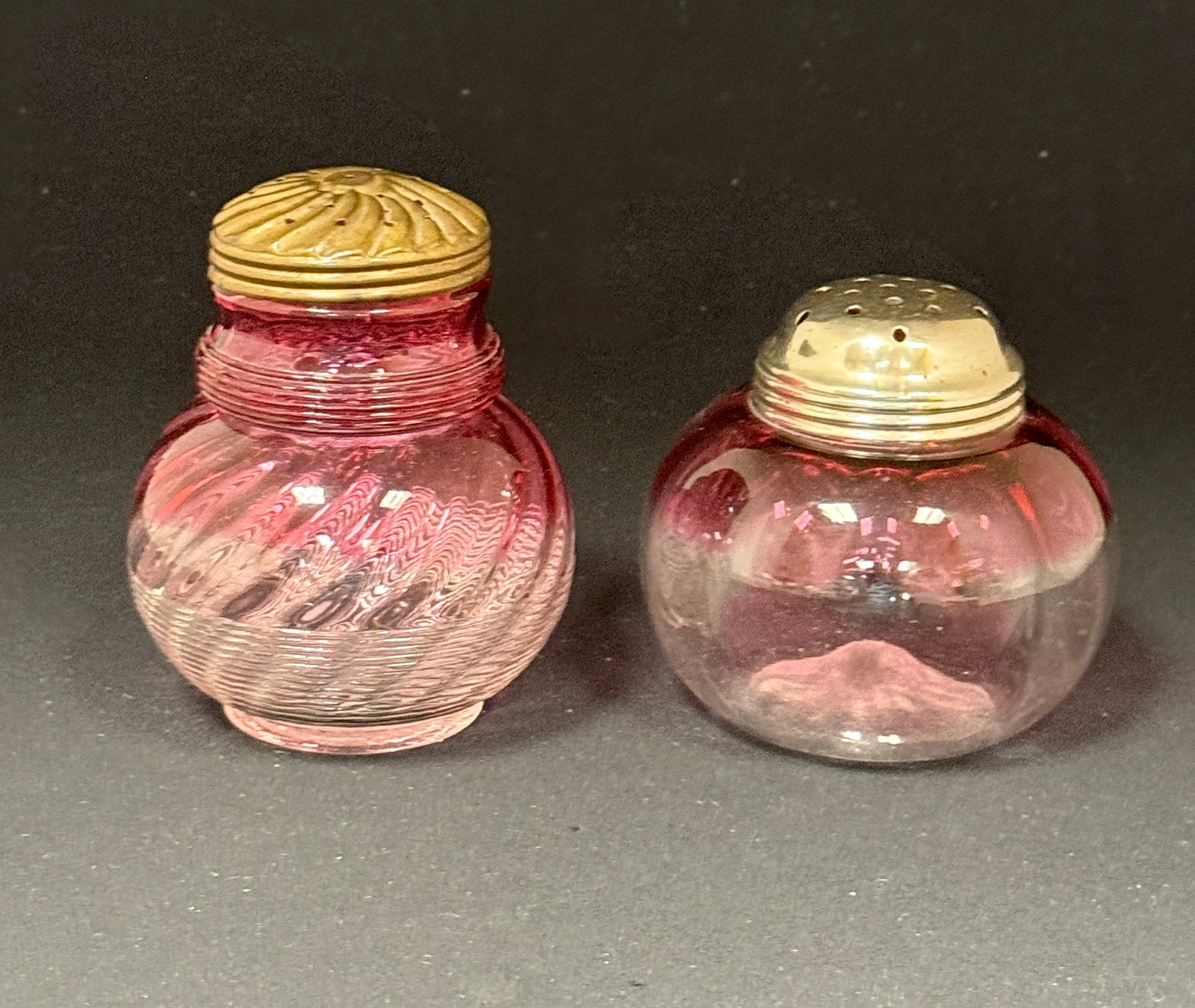 2 Rubina Sugar Shakers: 2 Rubina shakers: a jeweled threaded sugar shaker and a Hobbs sugar shaker; ht. 4 1/4". CONDITION: no chips, cracks, repairs, or material defects found, Jaremos attempts to call any material flaw