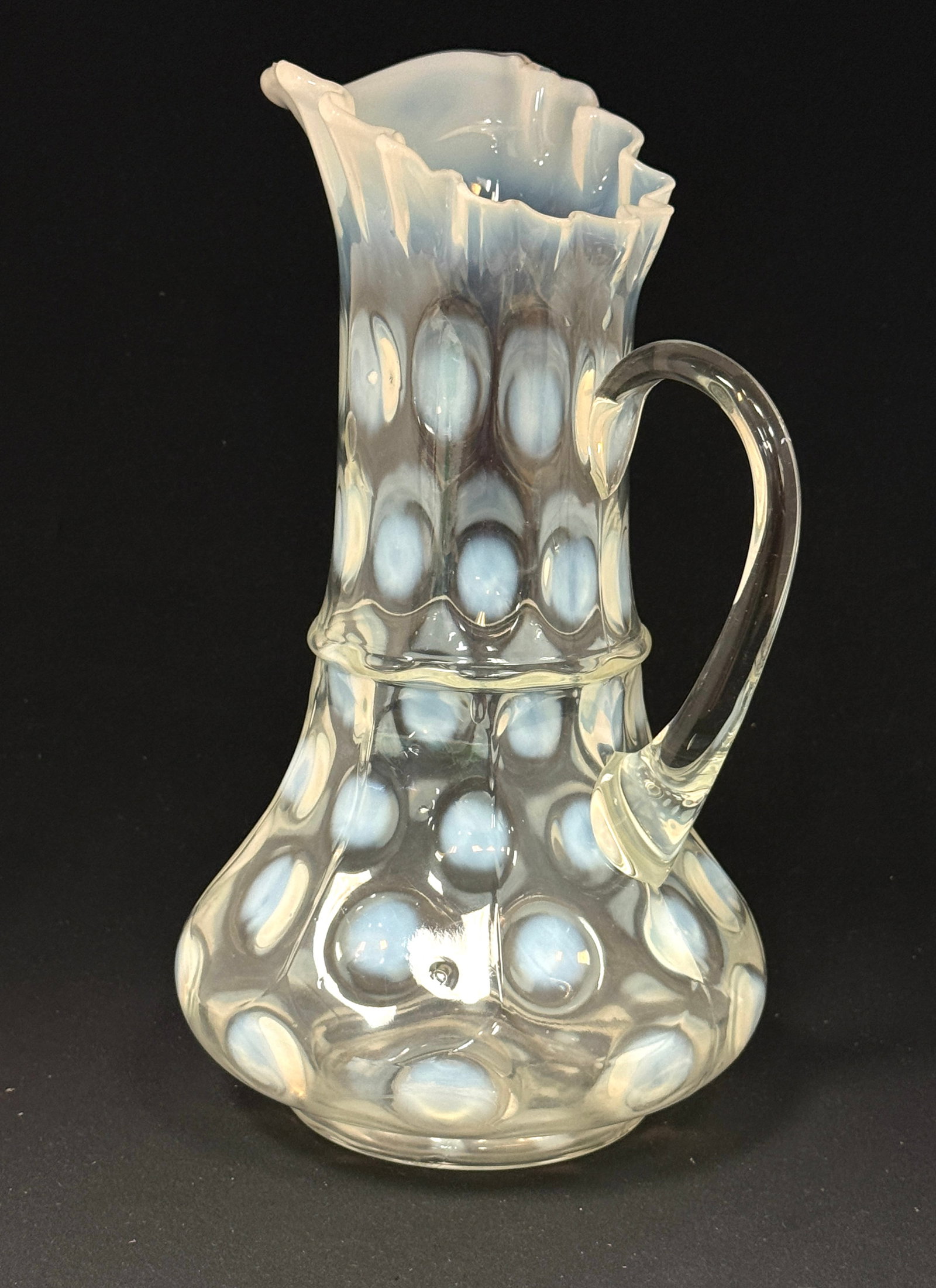 Opalescent 9 Panel Pitcher: Opalescent 9 panel coin spot clear pitcher; ht. 12". CONDITION: no chips, cracks, repairs, or material defects found, Jaremos attempts to call any material flaw that affects the price, but minor scrat