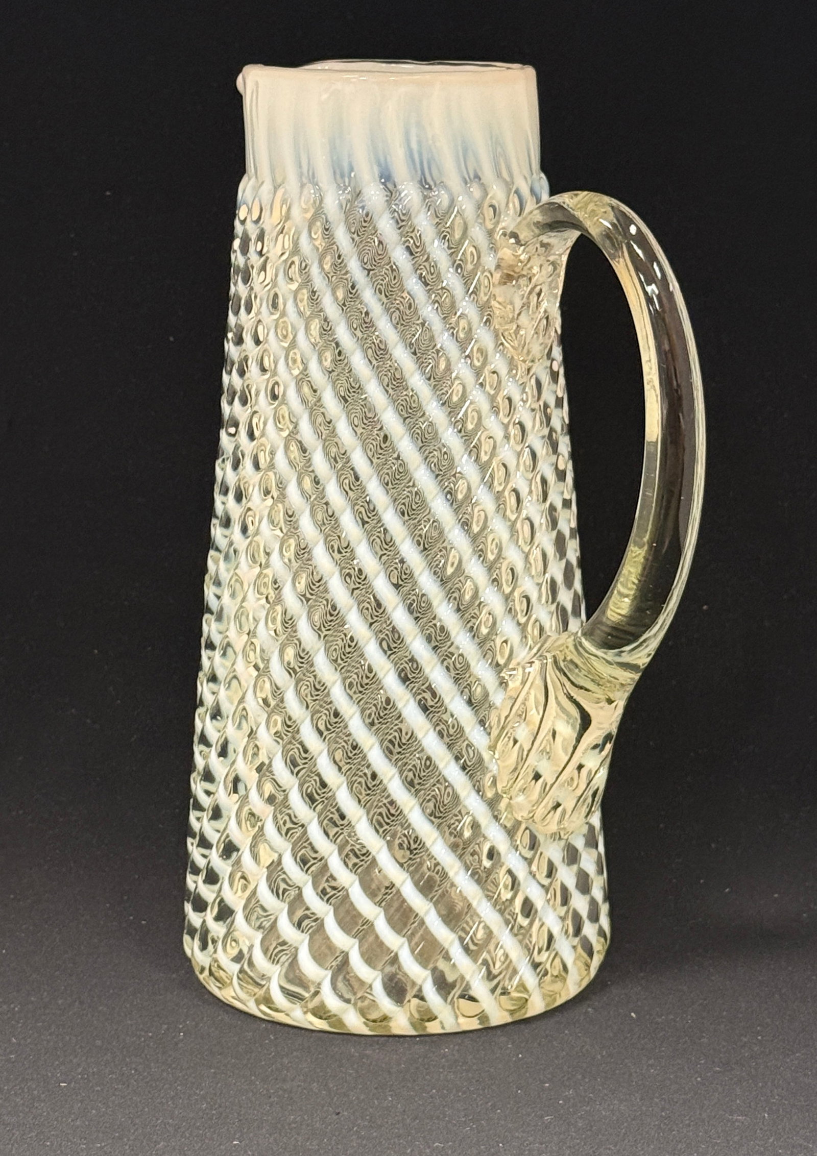 Opalescent Reverse Swirl Tankard: Opalescent reverse swirl white tankard; ht. 11". CONDITION: no chips, cracks, repairs, or material defects found, Jaremos attempts to call any material flaw that affects the price, but minor scratches