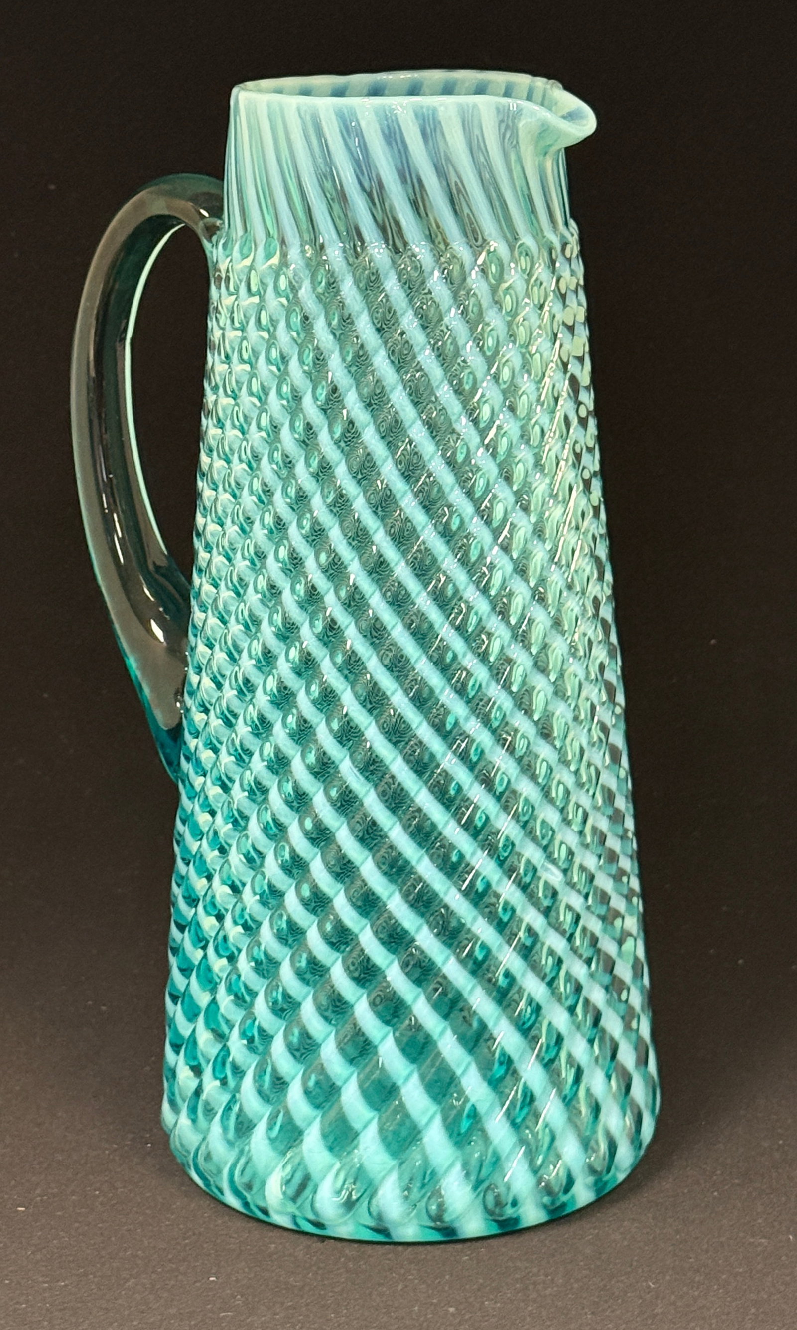 Opalescent Reverse Swirl Tankard: Opalescent reverse swirl blue tankard; ht. 11". CONDITION: no chips, cracks, repairs, or material defects found, Jaremos attempts to call any material flaw that affects the price, but minor scratches